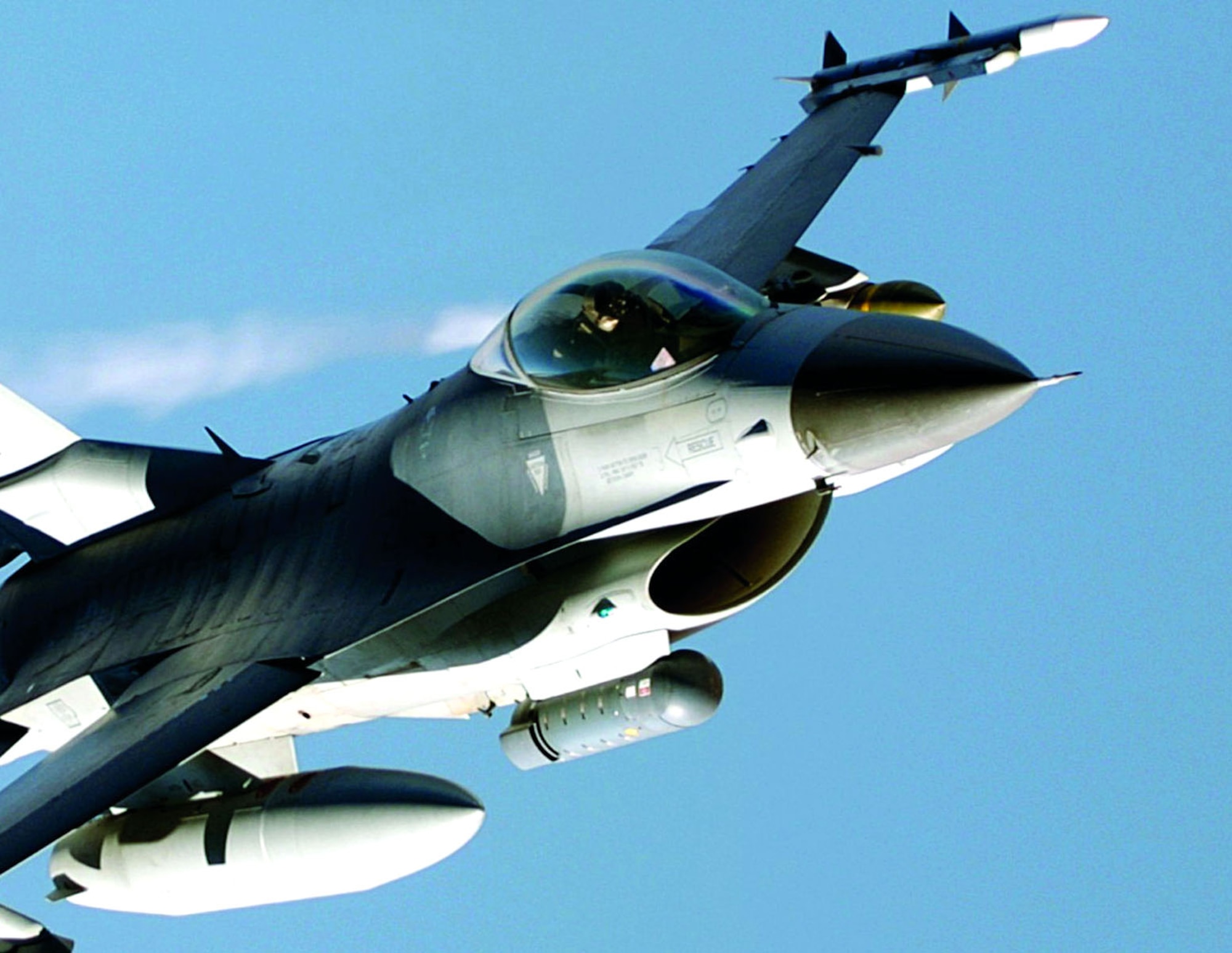 A LITENING pod, like the grey cylinder attached to the bottom of this F-16 Fighting Falcon's fuselage, is an operational precision targeting pod system used with a wide variety of combat aircraft. The 416th Flight Test Squadron at Edwards Air Force Base, Calif., recently started accelerated testing of a LITENING-AT targeting pod, which will update the existing LITENING pod with several new capabilities, including a video downlink transmitter currently used in the Predator Unmanned Aerial Vehicle. (Courtesy photo)