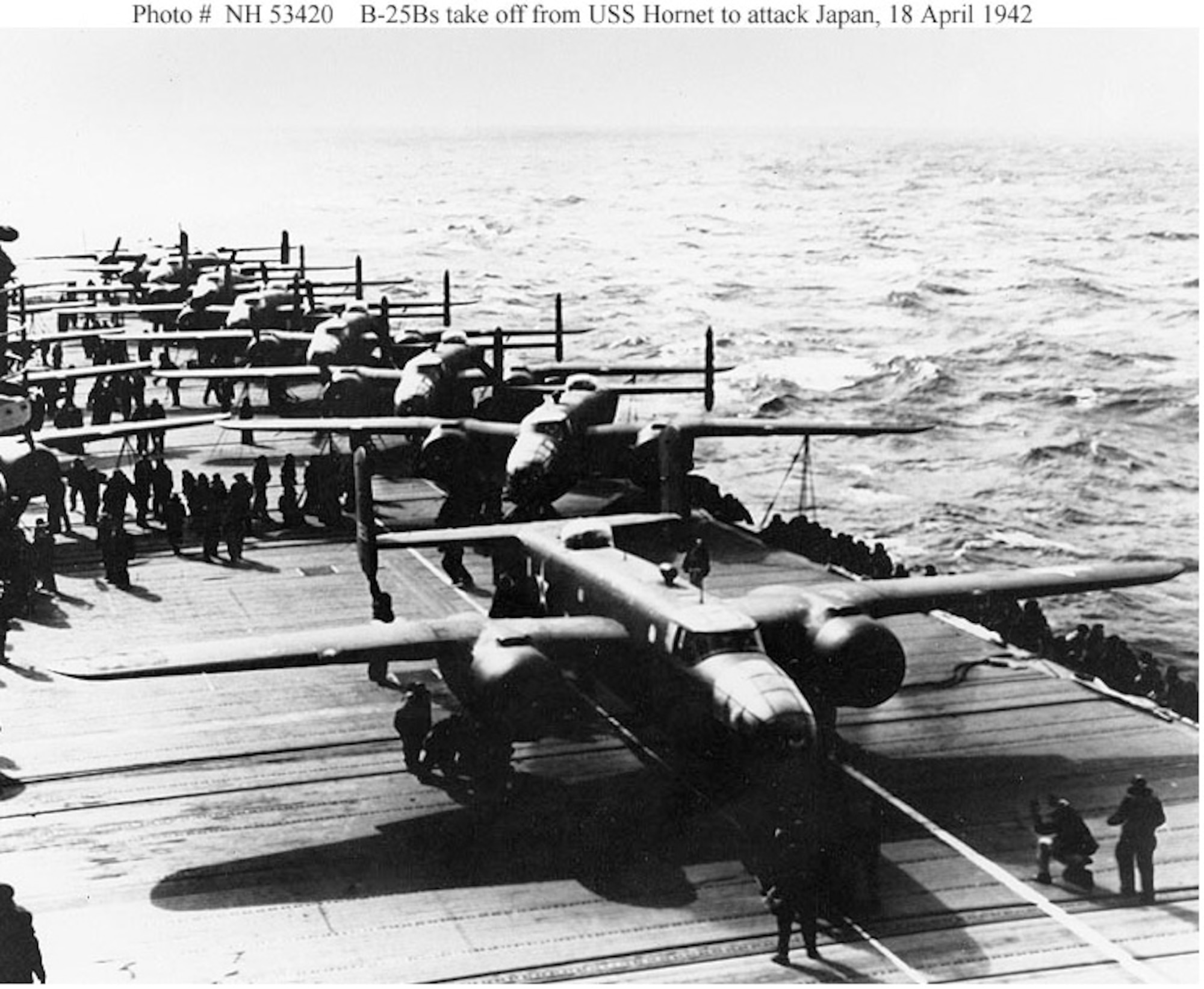 A U.S. Army Air Forces B-25B bomber lines up for takeoff from USS Hornet (CV-8), on the morning of April 18, 1942. Note white lines painted on the flight deck, below the plane's nose and  wheels, to guide the pilot during the takeoff run. This is the third or fourth plane to be launched. (U.S. Navy photo)