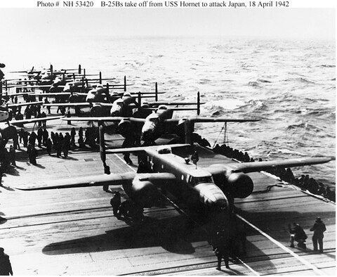 A U.S. Army Air Forces B-25B bomber lines up for takeoff from USS Hornet (CV-8), on the morning of April 18, 1942. Note white lines painted on the flight deck, below the plane's nose and  wheels, to guide the pilot during the takeoff run. This is the third or fourth plane to be launched. (U.S. Navy photo)