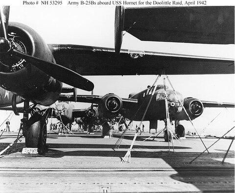 Some of the mission's B-25B bombers parked on the flight deck of USS Hornet (CV-8). Note use of the flight deck tie-down strips to secure the aircraft. (U.S. Navy photo)