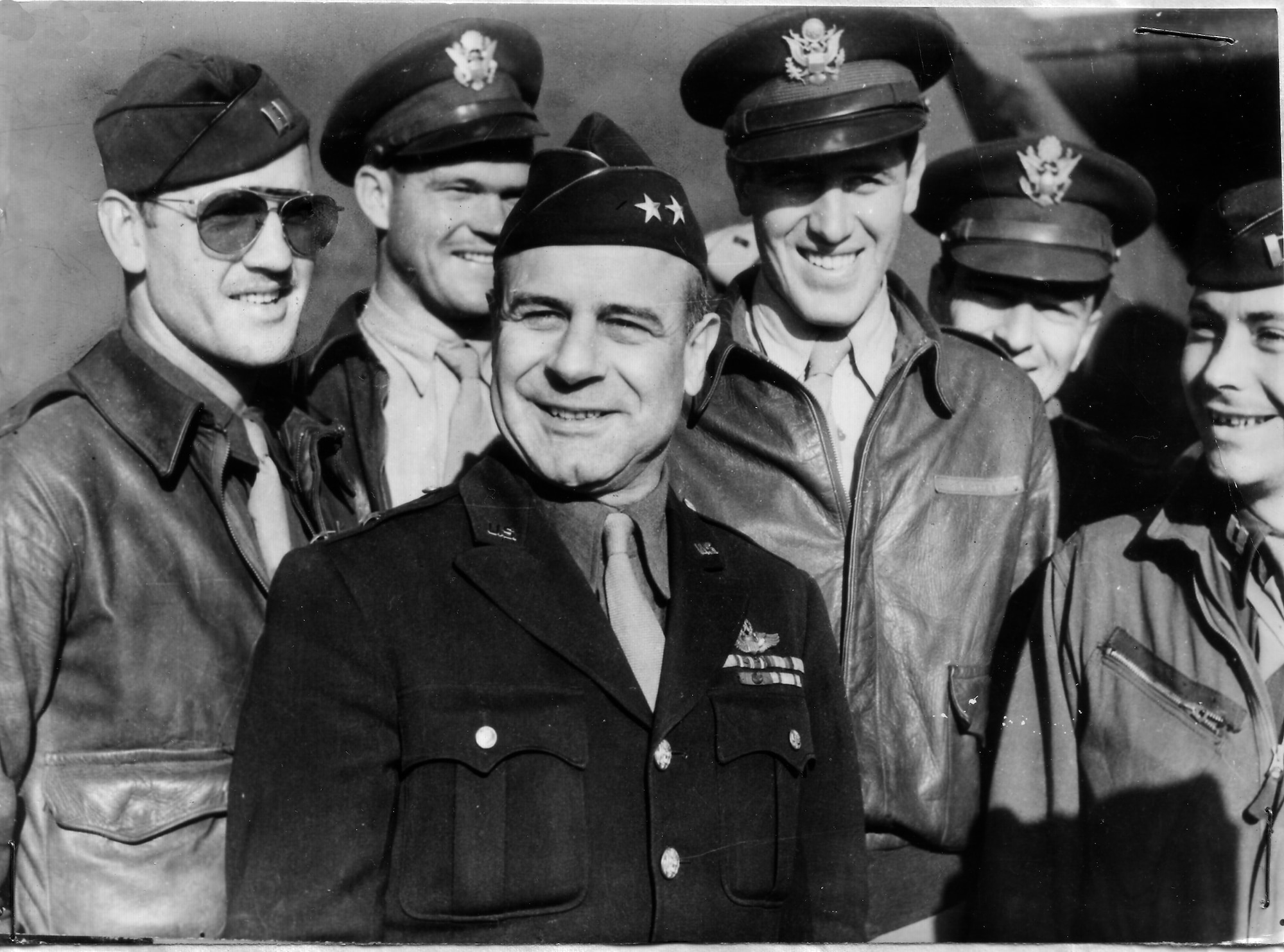 Lt. Gen. James H. Doolittle (center), commander of the Army Air Forces  Eighth Air Force, is surrounded by a group of U.S. flyers. (This picture was taken before his promotion to lieutenant general.)  The general took part in the first raid on Tokyo on April 18,1942, when a squadron took off from the USS Hornet in the North Pacific Ocean to bomb military installations in Japan. (U.S. Air Force photo)