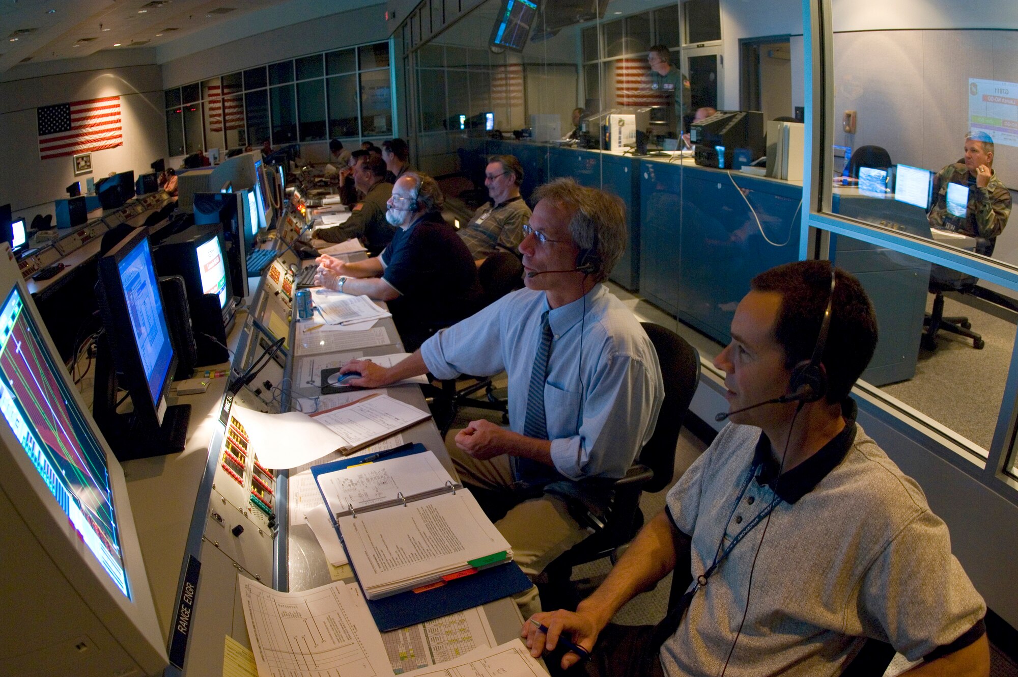 Members of the 45th Space Wing follow launch procedures during an integrated crew exercise, or ICE, on Thursday, April 13, 2006, at Cape Canaveral Air Force Station, Fla. The ICE tests personnel practices, anomaly resolution procedures and team communications. This is the final step in preparation for an April 20 launch that will carry a commercial satellite into orbit using an Atlas launch vehicle. (U.S. Air Force photo/Master Sgt. Jack Braden)
