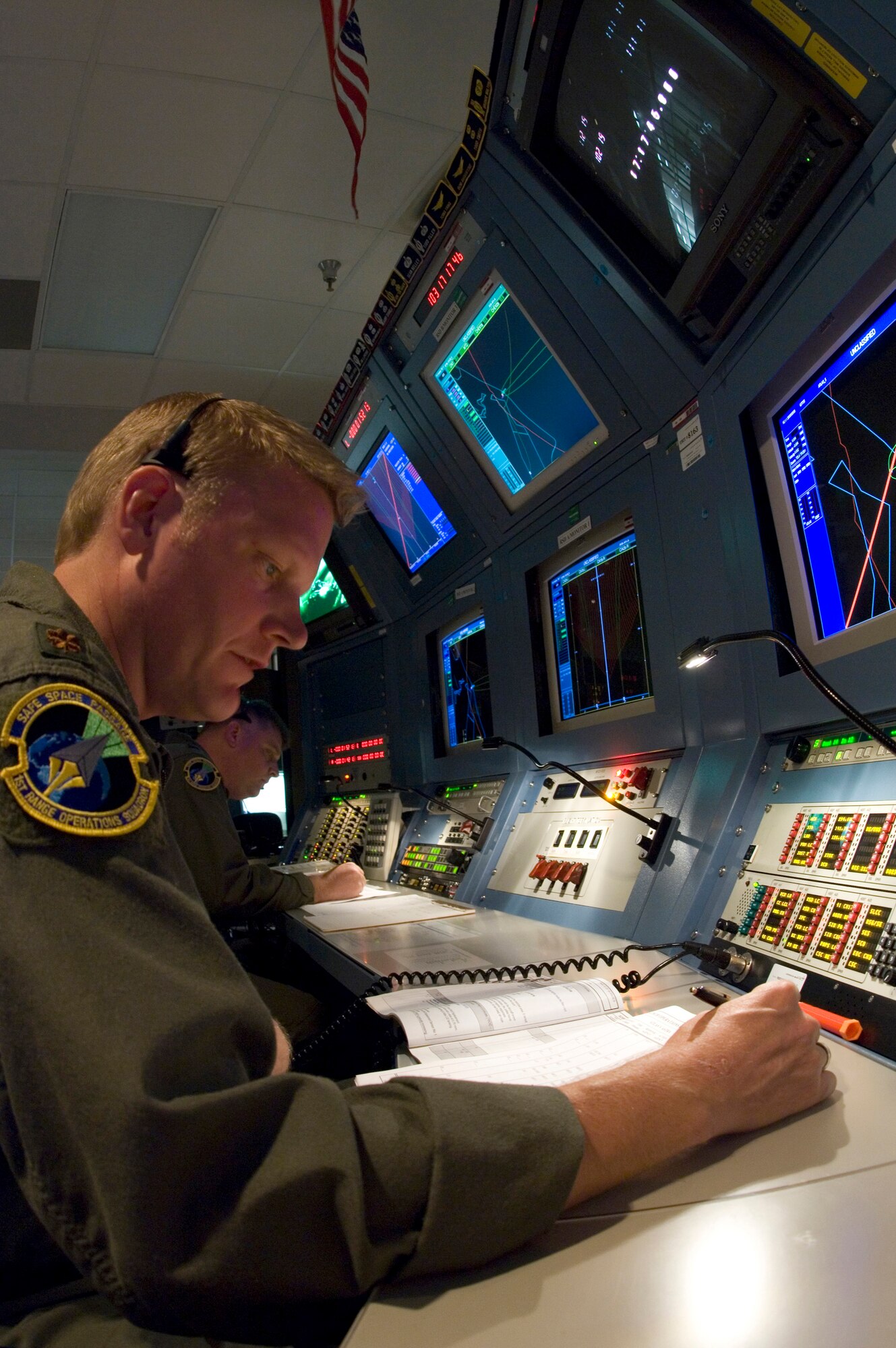 Maj. Kevin Vander Molen follows launch procedures at Cape Canaveral Air Force Station, Fla., during an integrated crew exercise, or ICE, on Thursday, April 13, 2006. The ICE tests personnel practices, anomaly resolution procedures and team communications. This is the final step in preparation for an April 20 launch that will carry a commercial satellite into orbit using an Atlas launch vehicle. Major Vander Molen is a senior mission flight controller with the 45th Space Wing at Patrick Air Force Base, Fla. (U.S. Air Force photo/Master Sgt. Jack Braden)