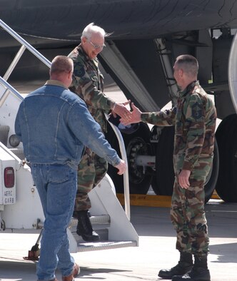 GRISSOM AIR RESERVE BASE, Ind. -- Master Sgt. Roger Redmon, a crew chief with the 434th Aircraft Maintenance Squadron, is greeted by SMSgt. Charles Hoover, right, and Master Sgt. Tony Hoffman, left, both 434th AMXS members, as he returns from a recent TDY. The flight was Sergeant Redmon's last in a 40-year career as a crew chief. (Photo by SrA. Roberto Modelo)
