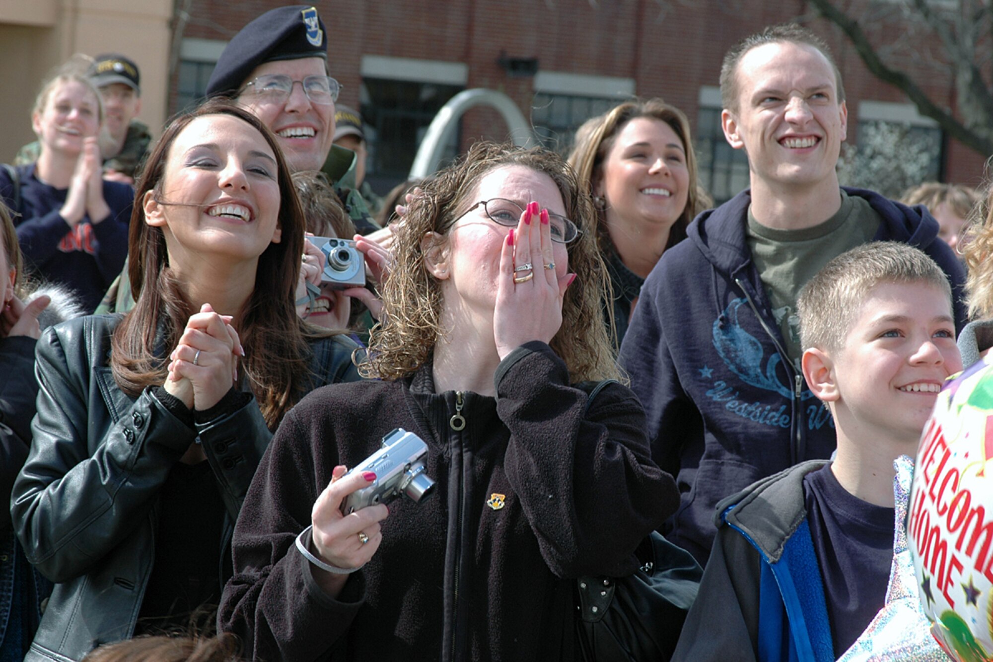 Ms Kim Gulleckson (center) prepares to reunite with her husband, Staff Sgt Darryl Gulleckson, 375th Security Forces Squadron, on the tarmac in front of Scott AFB Bases Operations following Sergeant Gulleckson's eight month deployment to Iraq.