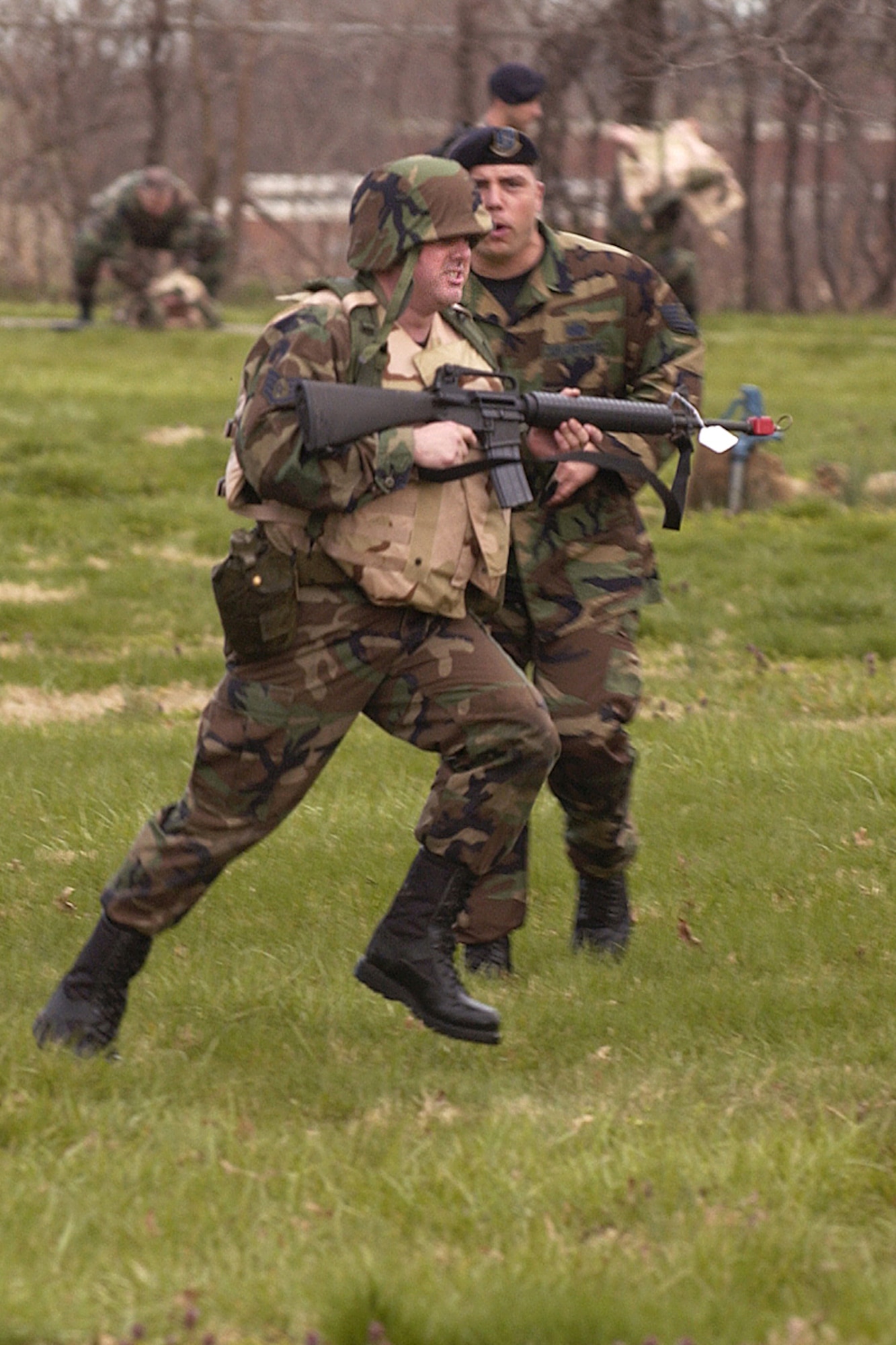 Scott Expeditionary Combat Skills trainee, Staff Sgt. Tony Tolley, 375th Communication Squadron, receives combat movements instruction from Tech. Sgt. Joseph Walters III, 375th Security Forces Squadron, as he tries to avoid enemy fire during the field exercise portion of the training.