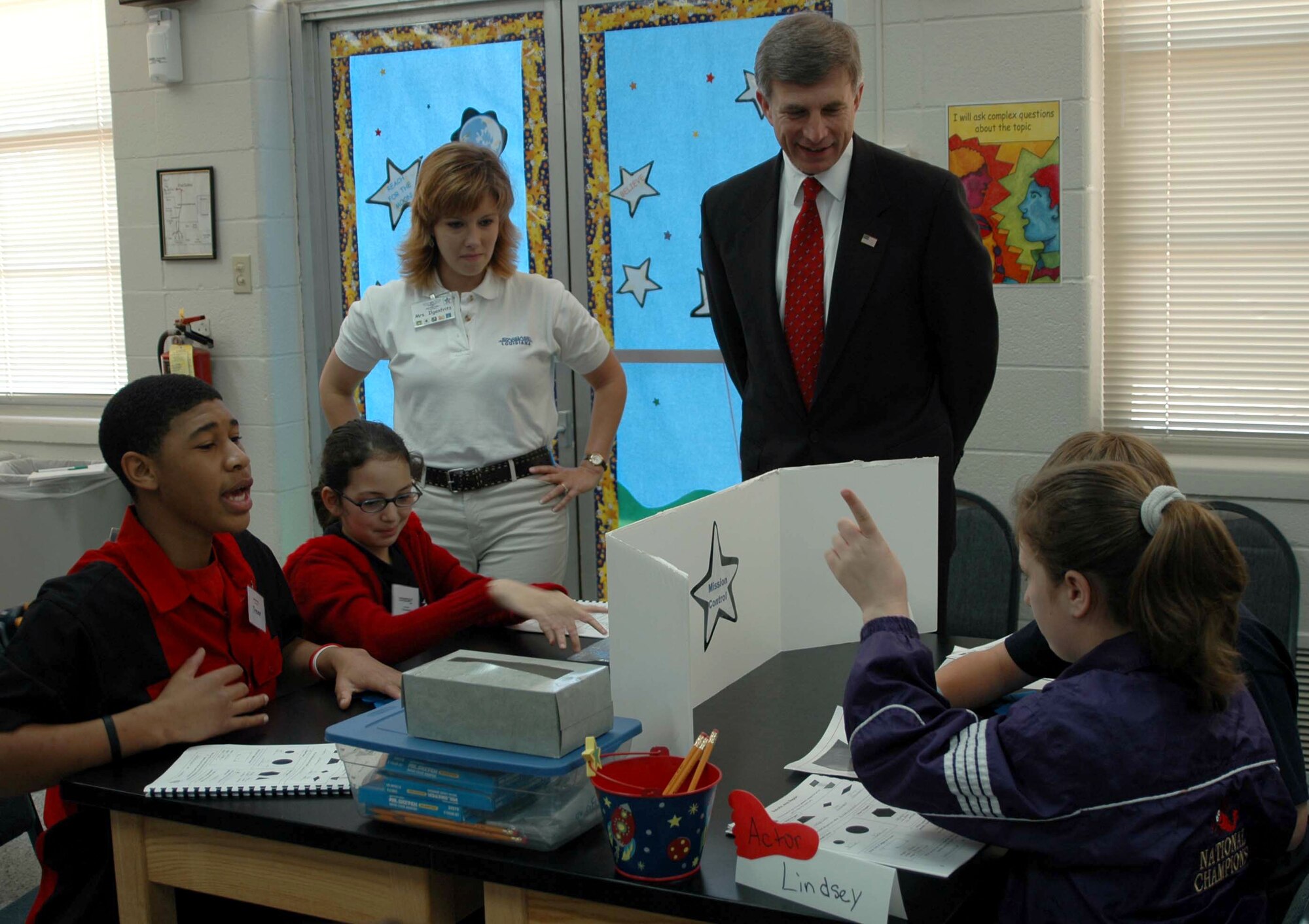 Laurie Ilgenfritz, a STARBASE Louisiana instructor, and Dr. Ronald Sega, undersecretary of the Air Force, observe Keithville, La., fifth graders participating in an exercise designed to build teamwork and communication skills.  Dr. Sega, a former astronaut and retired major general, took time from a visit at nearby Barksdale Air Force Base to spend time with the children.  (U.S. Air Force photo/Tech. Sgt. Sherri Savant)

