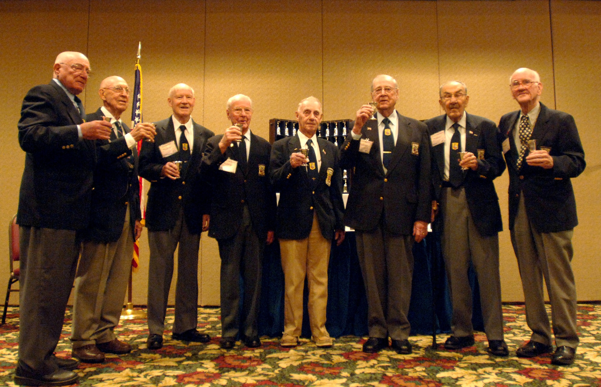 Eight of the surviving 16 Doolittle Raiders raise their goblets for their fallen brothers during their 64th reunion in Dayton, Ohio, April 18, 2006. (U.S. Air Force photo/Tech. Sgt. Cecilio M. Ricardo Jr.)

