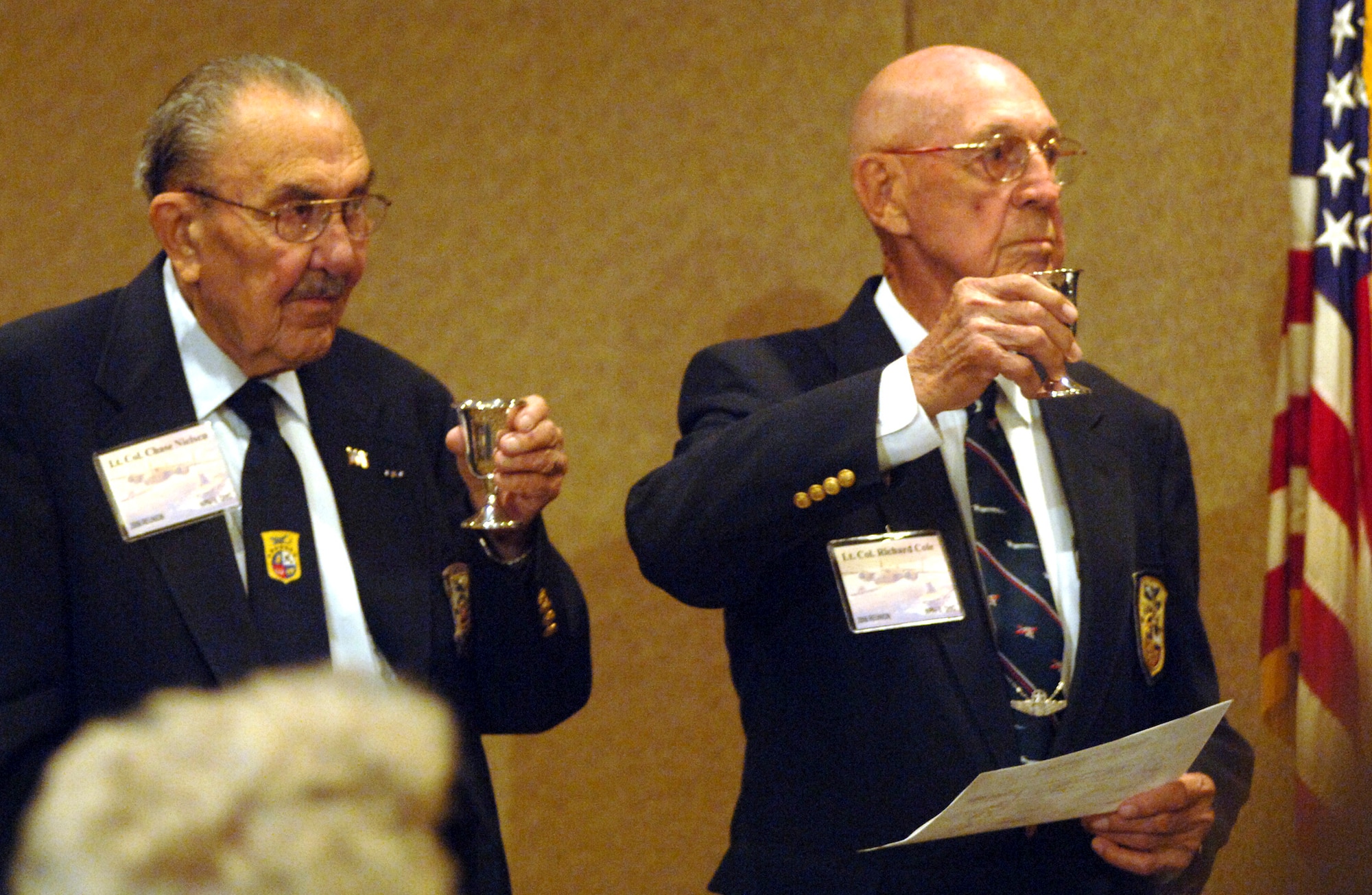 Doolittle Raiders, retired Lt. Col. Dick Cole (right) and retired Lt. Col. Chase Nielsen, raise their goblets to toast their fellow Raiders at the group's 64th reunion in Dayton, Ohio, on Tuesday, April 18, 2006. (U.S. Air Force photo/Tech. Sgt. Cecilio M. Ricardo Jr.)
