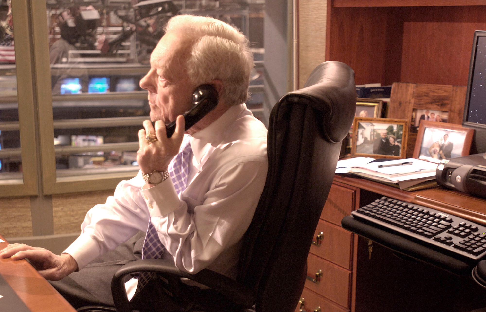 Bob Schieffer, chief Washington correspondent for "CBS News" and anchor/moderator of "Face the Nation," talks with a field reporter before an interview in his office at CBS in New York City on Tuesday, April 11, 2006. Mr. Schieffer once served as an Air Force public affairs officer at Travis Air Force Base, Calif. (U.S. Air Force photo/Master Sgt. Scott Wagers)
