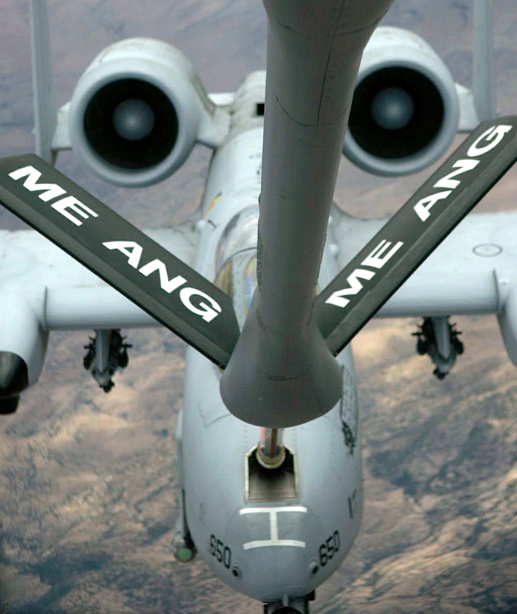 An A-10 Thunderbolt II receives fuel from a KC-135E Stratotanker during a training mission Friday, April 14, 2006, over Tucson, Ariz. The A-10 is from the 358th Fighter Squadron at Davis-Monthan Air Force Base, Ariz., and the KC-135E is from the Air National Guard's 101st Air Refueling Wing at Bangor, Maine. (U.S. Air Force photo/Senior Airman Christina D. Ponte)