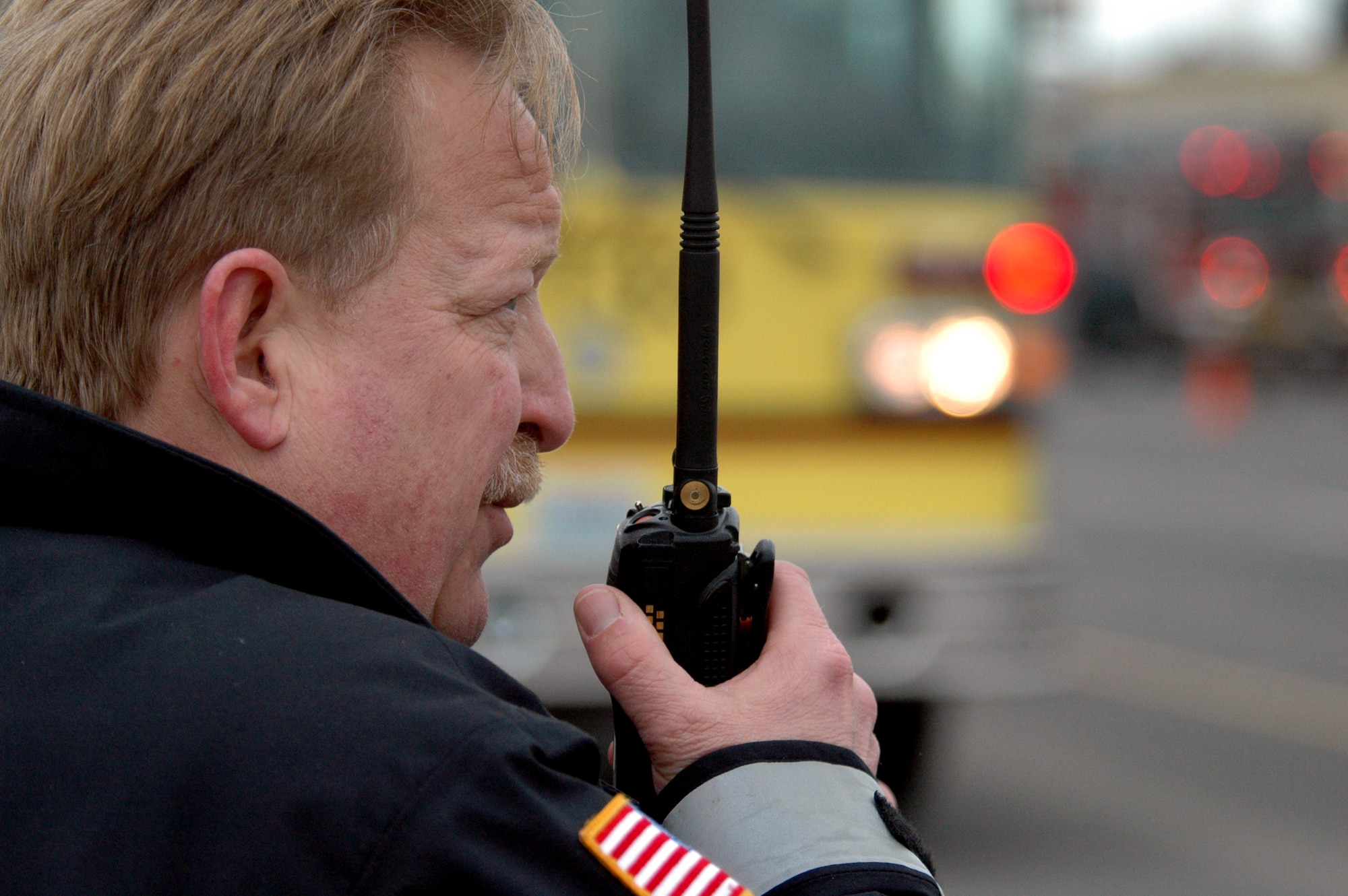 Chief Bill Nowlin, Fairchild fire chief, communicates with his team who is working inside the burning building. Fairchild teamed with local departments to extinguish the flames. (U.S. Air Force photo by Staff Sgt. Nathan Gallahan.)
