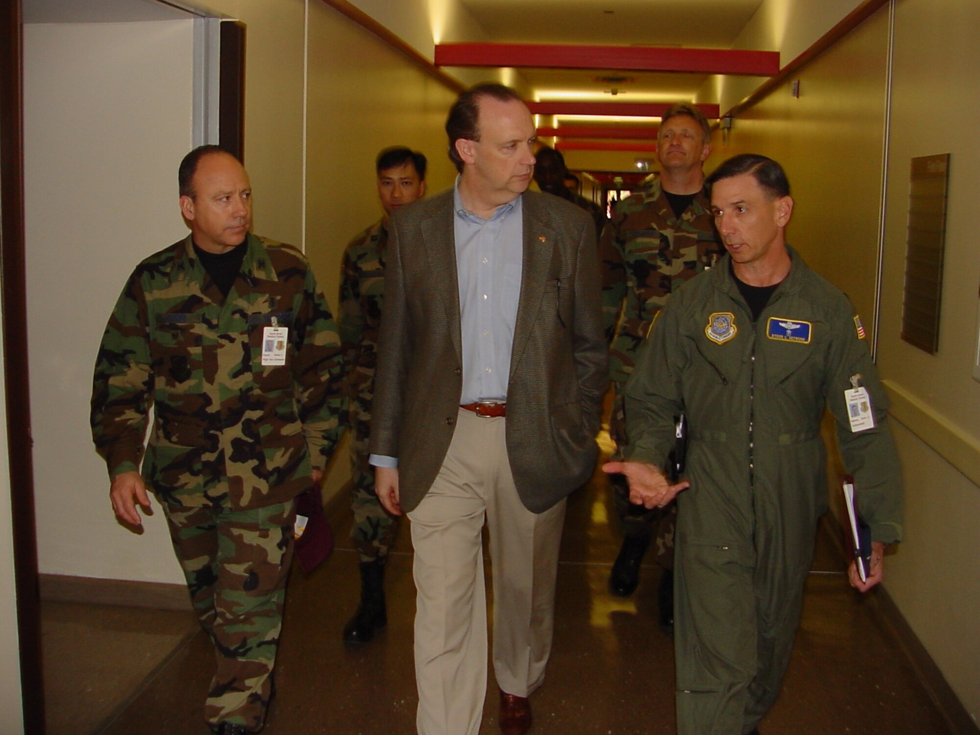 Honorable William "Bill" Anderson (center), Assistant Secretary of the Air Force for Installations, Environment and Logistics, Washington, D.C., is briefed by Col. (Dr.) Bryon Hepburn, 60th Medical Group commander (right), and Col. (Dr.) Michael Chyrek (left), 60th Aerospace Medicine Squadron acting commander during a visit to Travis April 13. Mr. Anderson's tour and briefing at DGMC included operational/occupational medicine, the aeromedical staging facility, hyperbarics medicine, flight medicine, public health and bioenvironmental engineering. (U.S. Air Force photo by Jim Spellman)