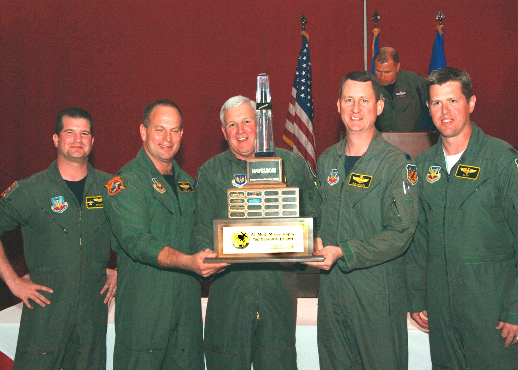 Members of the 303rd Fighter Squadron's Hawgsmoke team accept the "Al 'Mud' Moore Trophy for Top Overall A-10 Unit" at the Hawgsmoke Awards Banquet March 25 at Davis-Monthan Air Force Base, Ariz., from Lt. Gen. Glen W. Moorhead III, commander of 16th Air Force. From left, Capt. Brian Leiter, Lt. Col. James Mackey,  Lt. Col. Ronald Hankes and Maj. Stephen Nester won the award for best A-10 unit among 20 A-10 squadrons from U.S. Air Force bases throughout the world after competing in the aerial gunnery and bombing competition held every two years.  The 303rd Fighter Squadron is part of the Air Force Reserve's 442nd Fighter Wing, based at Whiteman AFB, Mo.