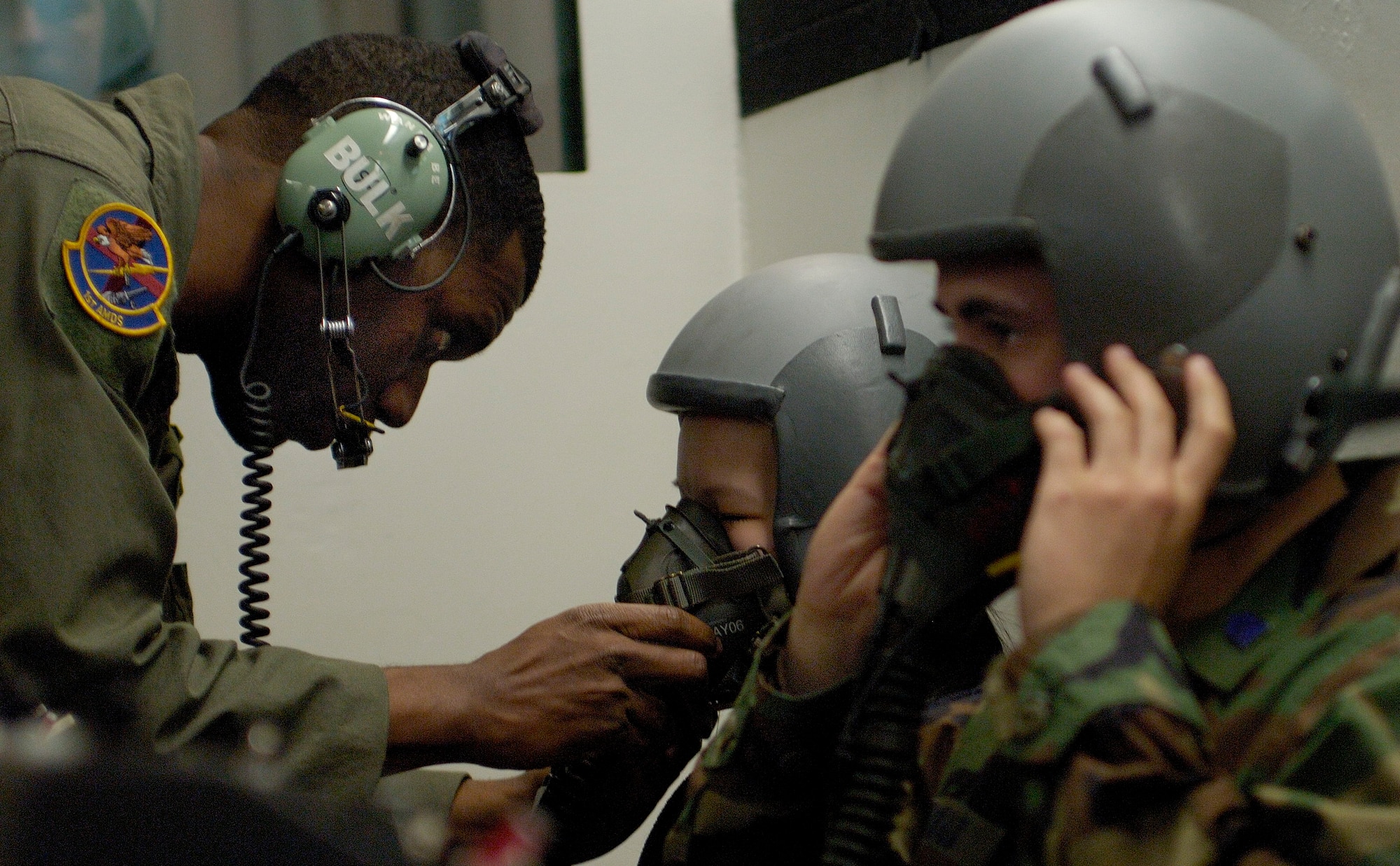 Tech Sgt. Rodney Morris (left) , an aerospace physiology technician stationed at Langley AFB, checks the oxygen masks of a Federal Aviation Administration student in the altitude chamber on 19 Apr 2006 at the Aerospace Physiology facility on Langley. While in the altitude chamber students are exposed to atmospheric conditions at 25,000 ft. Without the aid of an oxygen mask they experience symptoms of hypoxia, a oxygen deficiency of the tissue and blood cells that causes impairment of function at high altitudes. (USAF Photo By SSgt Samuel Rogers)