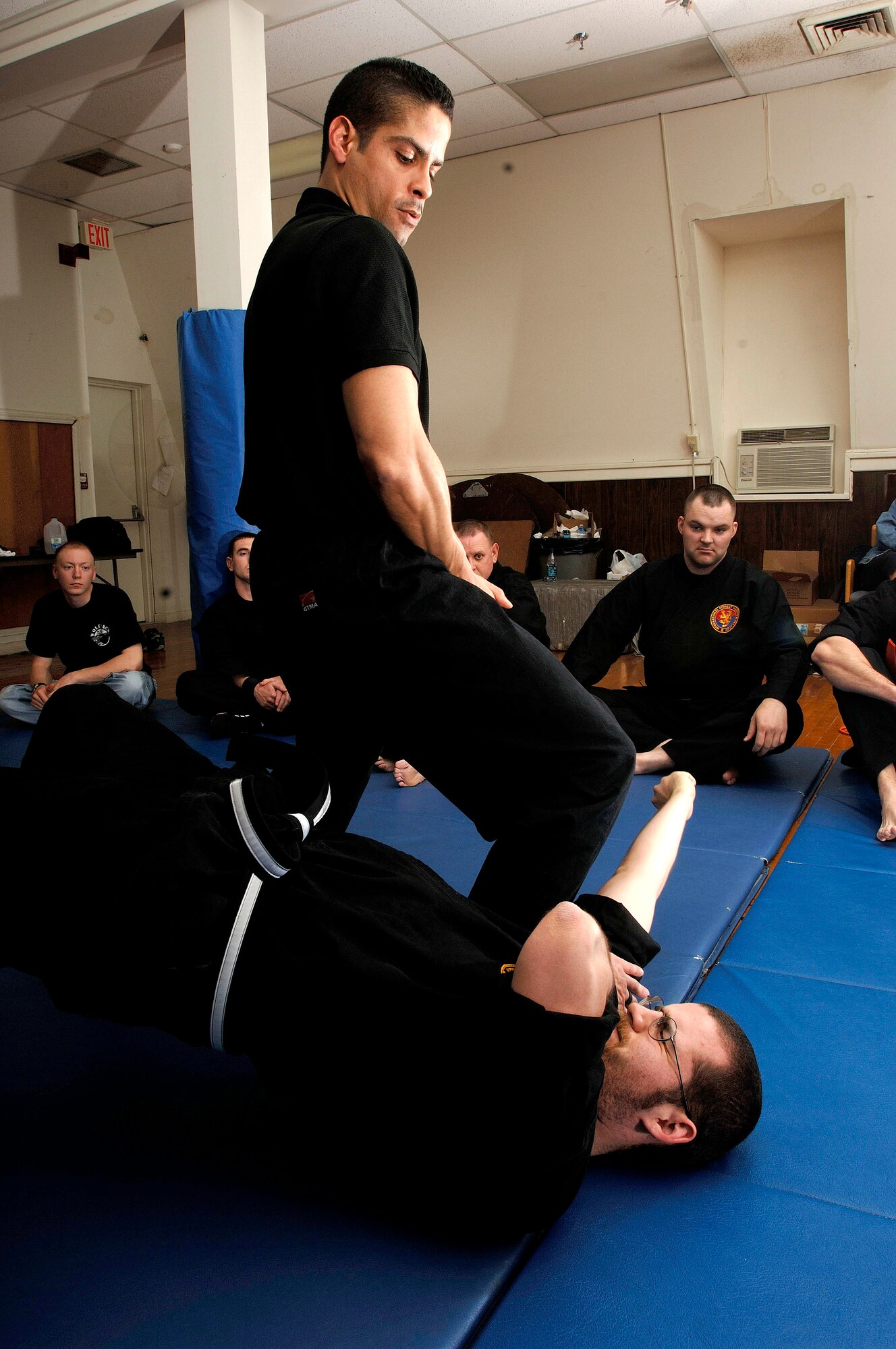 Technical Sergeant David Rivas demonstrates "pain compliance " by manipulating the wrist of a student of his Combat Hapkido class, on Langley Air Force Base Virginia, April 11 2006.  The modern style martial art emphasizes practical self defense for real life situations. (USAF photo by Airman First Class Christopher L. Ingersoll)

