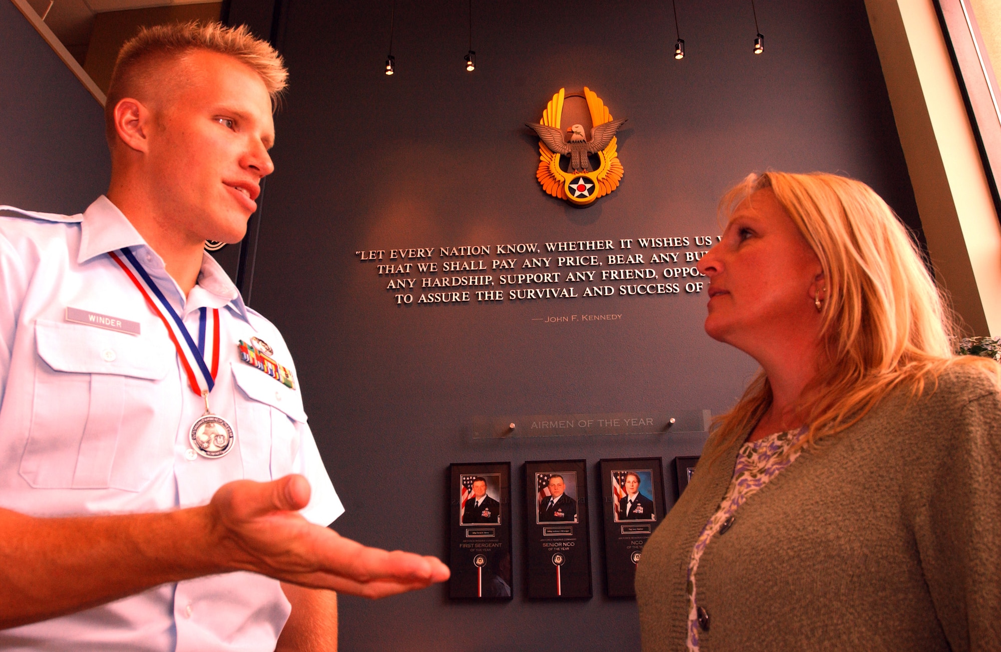 Senior Airman Kris Winder talks with his mother, Marcia Smith about the Air Force Reserve Command's 12 Outstanding Airman of the Year awards banquet inside the headquarters' Heritage Hall April 19. (U.S. Air Force photo/Master Sgt. Jason Tudor)