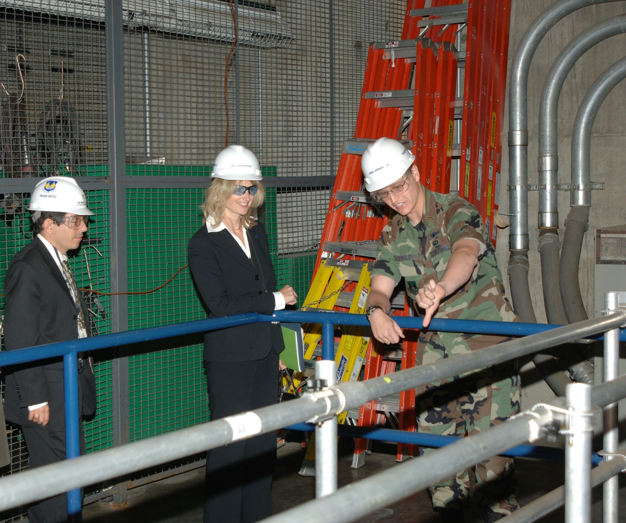 ARNOLD AIR FORCE BASE, Tenn. - Second Lt. Tim Higley briefs Air Force Chief Scientist Dr. Mark Lewis and Dr. Lisa Porter, NASA Associate Administrator for Aeronautics research, in Arnold Engineering Development Center's J-6 rocket test facility during their visit. (Air Force photo)