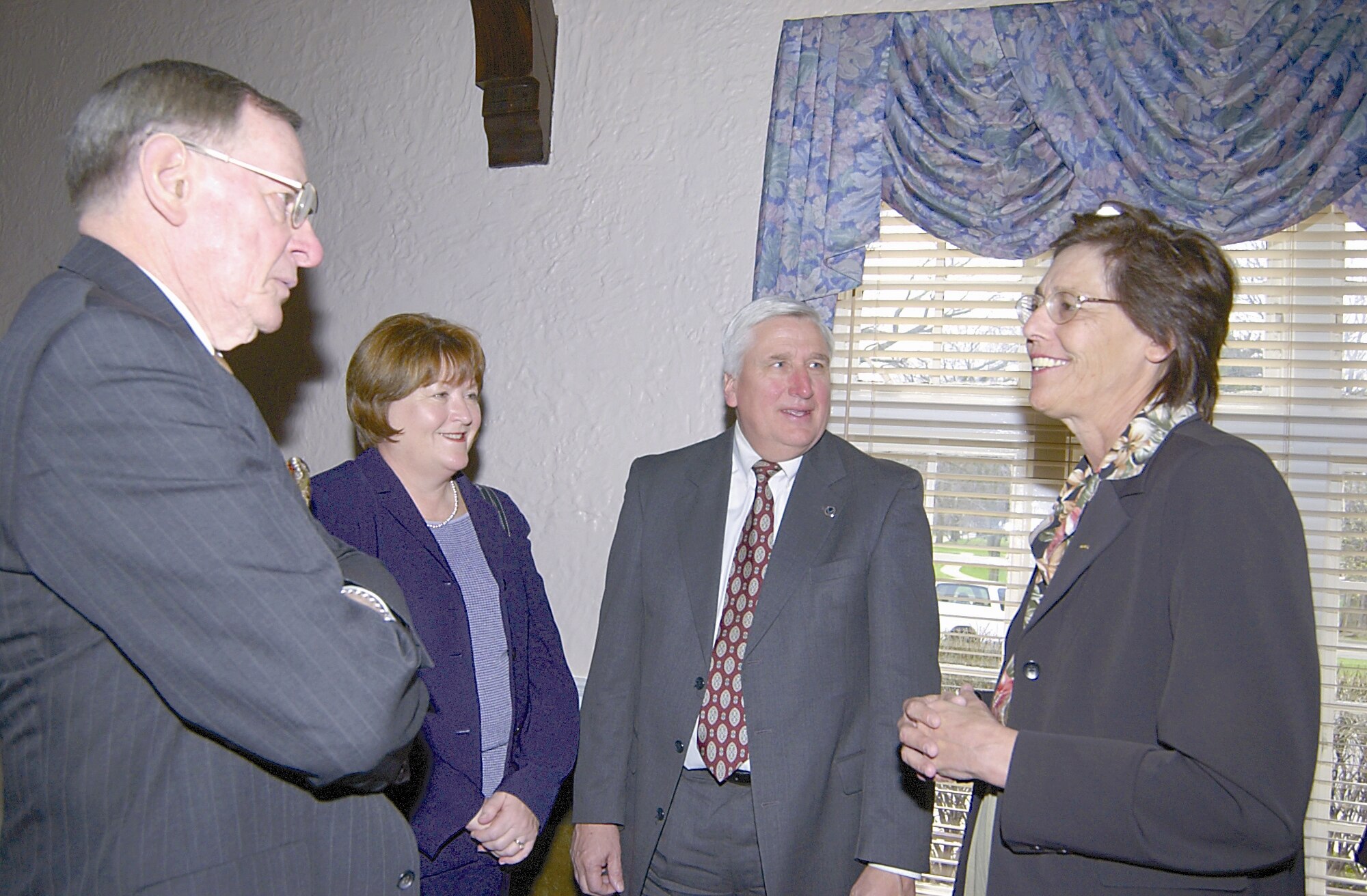 WRIGHT-PATTERSON AIR FORCE BASE, Ohio - From left, retired Maj. Gen. Charles Metcalf, National Museum of the U.S. Air Force director, Linda McLaughlin assistant to the 88th Air Base Wing commander, and Tom Koogler, Air Force Security Assistance Center executive director, talk with Mary Lacey, National Security Personnel System program executive officer, April 11 at the Wright-Patterson Club and Banquet Center.

(Air Force photo by Spencer P. Lane)

