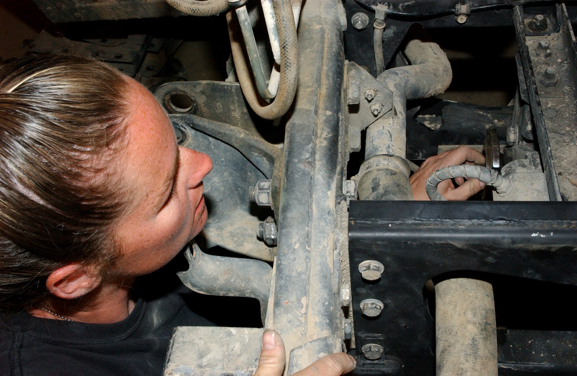 Staff Sgt. Shane Chandler inspects a brake differential for damage on a Humvee at Ali Base, Iraq. Sergeant Chandler is assigned to the 407th Expeditionary Logistics Readiness Squadron vehicle maintenance flight and is deployed from Malmstrom Air Force Base, Mont. (U.S. Air Force photo/Master Sgt. Jon Hanson)