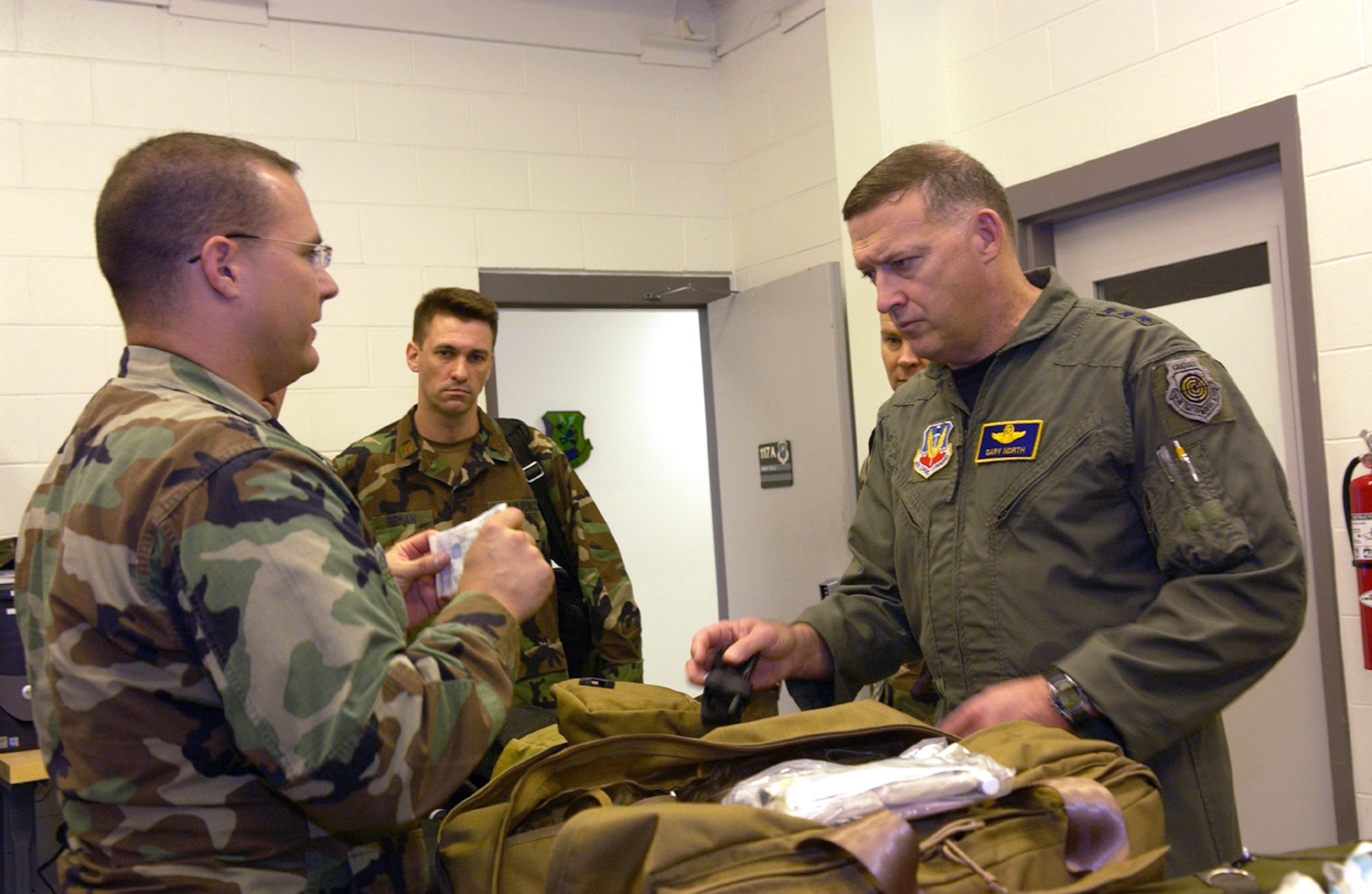 Capt. David Williams briefs Lt. Gen. Gary L. North, 9th Air Force commander, during his tour at Moody Air Force Base, Ga., on Wednesday, April 19, 2006. The captain showed the general the new warrior aid and liter kit, which is an expanded, vehicle-mounted self-aid and buddy care system. Captain Williams is assigned to the 820th Security Forces Group. (U.S. Air Force photo/Airman Elizabeth Rissmiller)