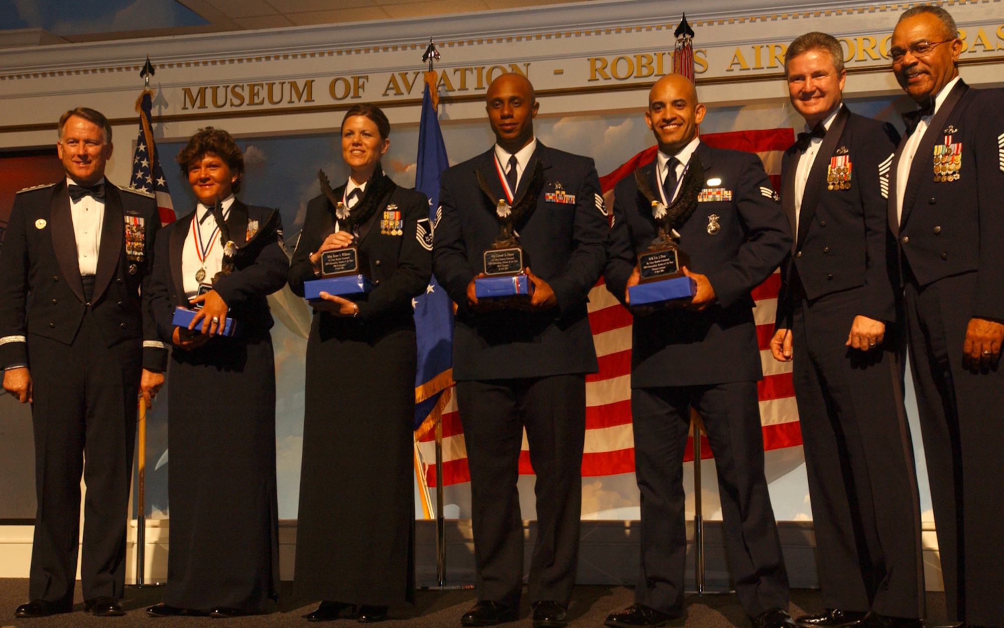 Air Force Reserve Command announced its Outstanding Airmen of the Year and First Sergeant of the Year winners during ceremonies April 20 at the Robins Air Force Base (Ga.) Museum of Aviation. From left, Lt. Gen. John A. Bradley, AFRC commander and chief of Air Force Reserve; Senior Master Sgt. Kathleen Buckner, first sergeant; Master Sgt. Renee Williams, senior NCO; Staff Sgt. Conrad Dawes Jr., NCO; Senior Airman Eric Pena, airman; Chief Master Sergeant of the Air Force Gerald R. Murray; and AFRC Command Chief Master Sgt. Jackson A. Winsett. (U.S. Air Force photo/Master Sgt. Ellen Wilt)