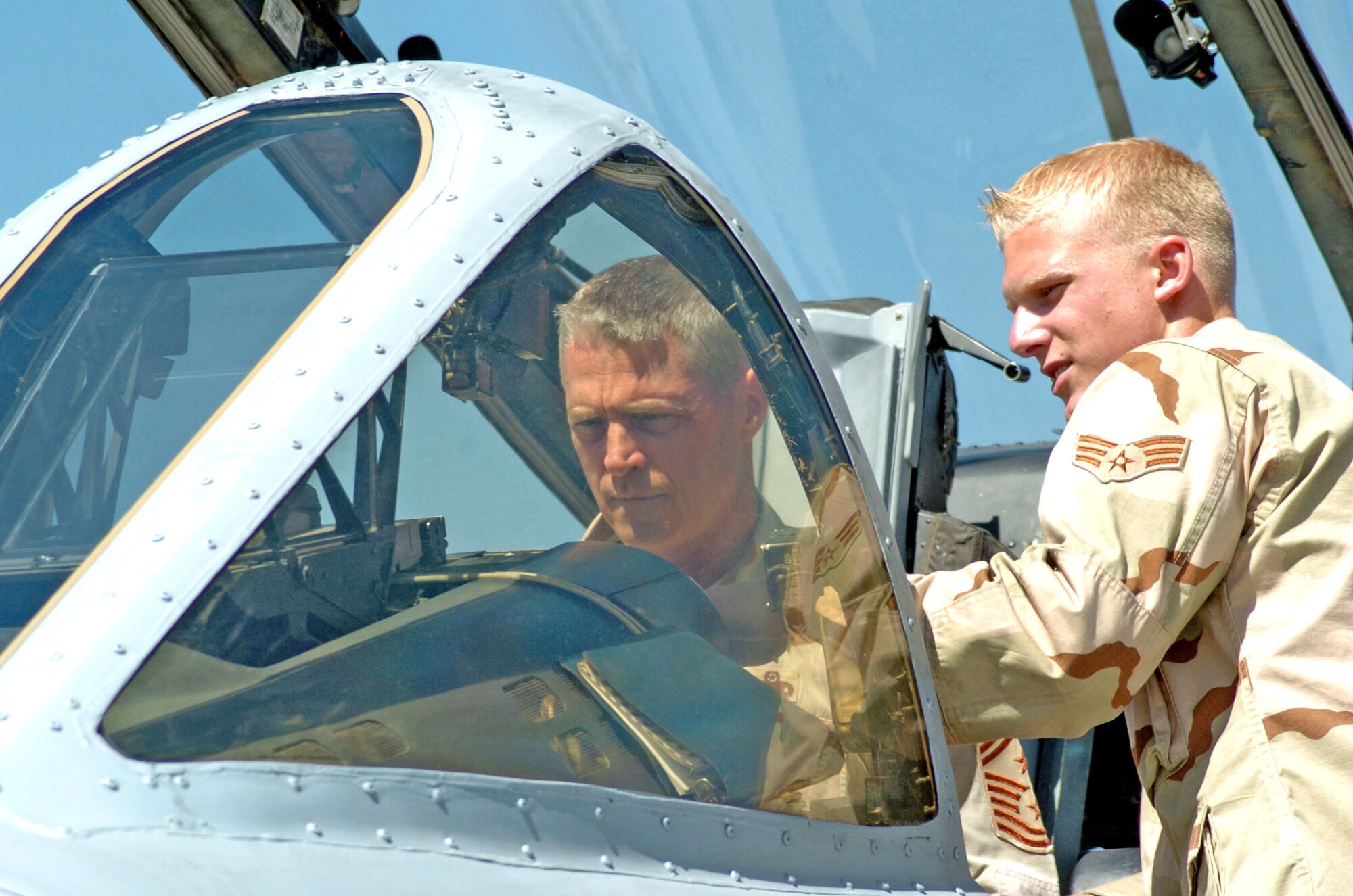 Chief Master Sgt. Curt Brownhill gets an A-10 Thunderbolt II tour from Senior Airman Justin Dillon during a visit to Bagram Air Base, Afghanistan.  Chief Brownhill is the command chief of U.S. Central Command. Airman Dillon is assigned to the 355th Expeditionary Aircraft Maintenance Squadron. (U.S. Air Force photo/Staff Sgt. Jasmine Reif)
