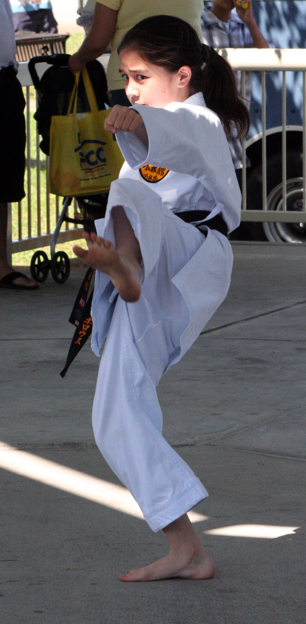 Alina Burroughs, daughter of Master Sgt. Richard Burroughs, demonstrates karate forms under the pavillion during Saturday's Family Fest.
