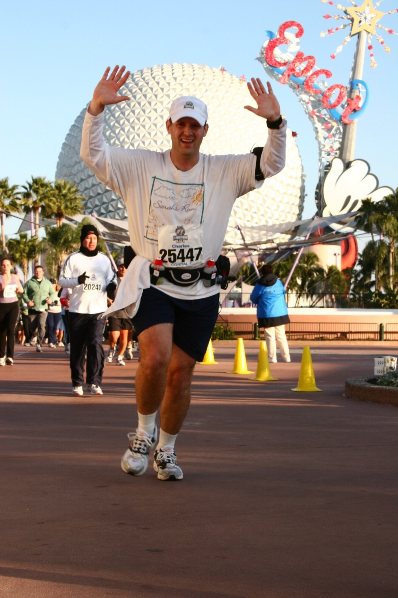 Master Sgt. Charles "Tom" Rados, at the 12.5 mile mark in teh front of the Epcot Center's Spaceship Earth attraction, is in the finishing stretch of the Disney Half Marathon. Less than a year after having difficulty running the Air Force's required 1.5 miles, Seregeant Rados finished the 13.1 mile race at a 10:51 pace. He has been an example to those in his squadron.
