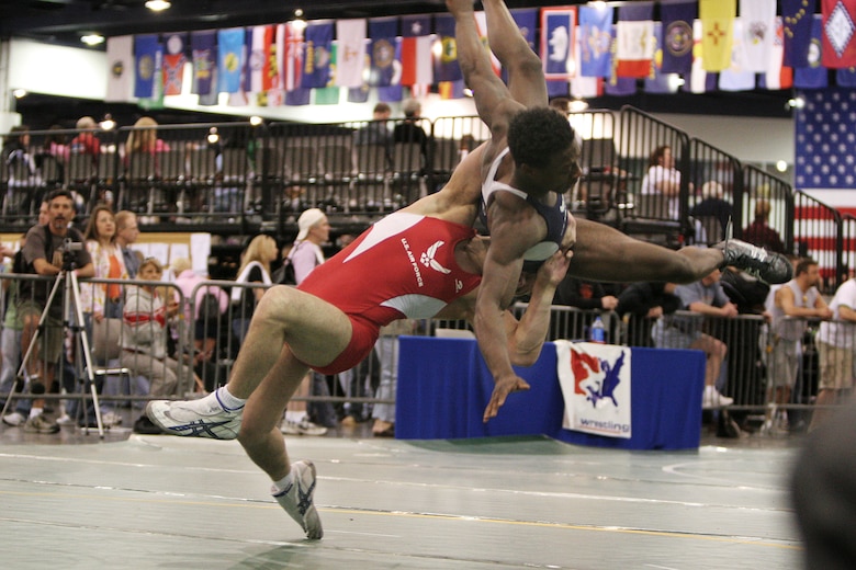 Senior Airman Jared Moreland performs a lift and toss on his opponent and fellow teammate Capt. Anthony Brooker at the USA National Senior Men's and Women's Wrestling Championships in Las Vegas on Saturday, April 15, 2006. Captain Brooker recovered and went on to win the match and finish seventh overall. He is stationed at Vandenberg Air Force Base, Calif., and Airman Moreland is at Cannon AFB, N.M. (U.S. Air Force photo/Master Sgt. Robert W. Valenca)