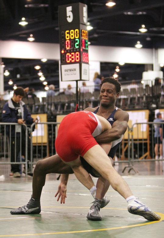 Capt. Anthony Brooker attempts a lift and toss on his opponent and fellow teammate Senior Airman Jared Moreland at the USA National Senior Men's and Women's Wrestling Championships in Las Vegas on Saturday, April 15, 2006. Captain Brooker went on to win the match and finish seventh overall. He is stationed at Vandenberg Air Force Base, Calif., and Airman Moreland is at Cannon AFB, N.M. (U.S. Air Force photo/Master Sgt. Robert W. Valenca)