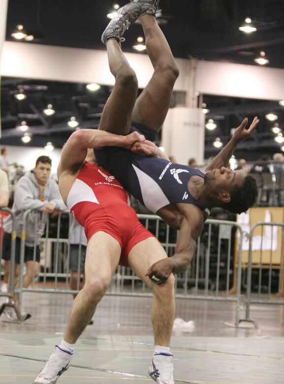 Senior Airman Jared Moreland performs a lift and toss on his opponent and fellow teammate Capt. Anthony Brooker at the USA National Senior Men's and Women's Wrestling Championships in Las Vegas on Saturday, April 15, 2006. Captain Brooker recovered and went on to win the match and finish seventh overall.  He is stationed at Vandenberg Air Force Base, Calif., and Airman Moreland is at Cannon AFB, N.M. (U.S. Air Force photo/Master Sgt. Robert W. Valenca)