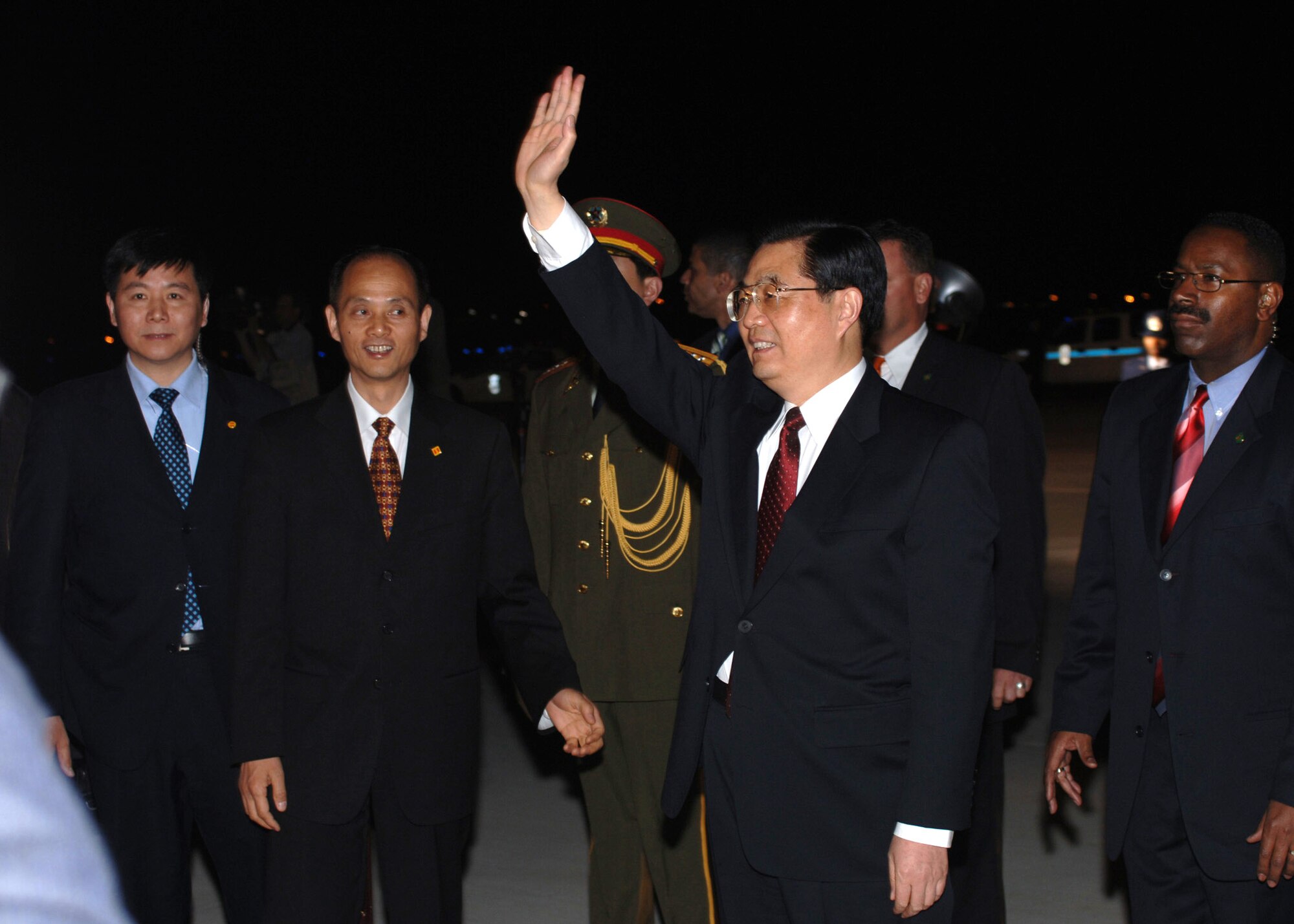 President Hu Jintao of China waves to the crowd after his arrival at Andrews Air Force Base, Md., Thursday, April 19, 2006. (U.S. Air Force photo/Staff Sgt. Jason W. Edwards) 
