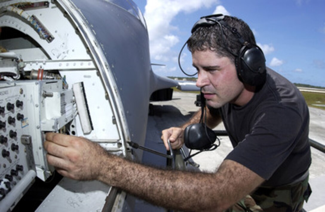 Air Force Airman 1st Class Francis Pacheco performs maintenance on avionics equipment in a B-1B Lancer aircraft on the flight line at Andersen Air Force Base, Guam, on April 17, 2006. Pacheco is attached to the 36th Expeditionary Aircraft Maintenance Squadron. 