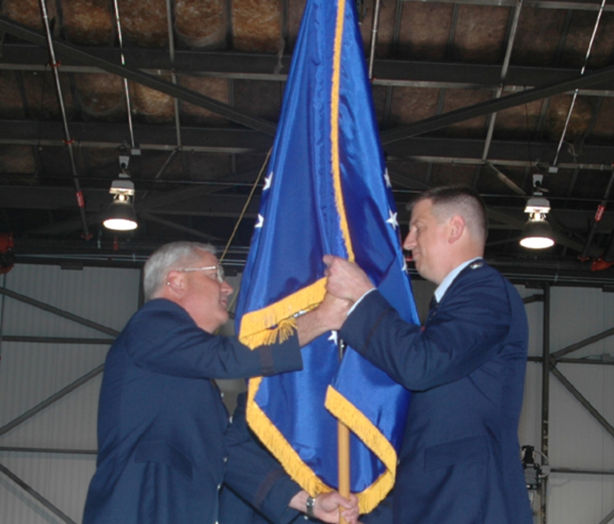 Col. Stan Sheley (right) accepts the 434th Maintenance Group flag from Brig. Gen James Melin, 434th Air Refueling Wing commander, during an assumption of command ceremony.  (U.S. Air Force photo/SrA Jonathan Jones)