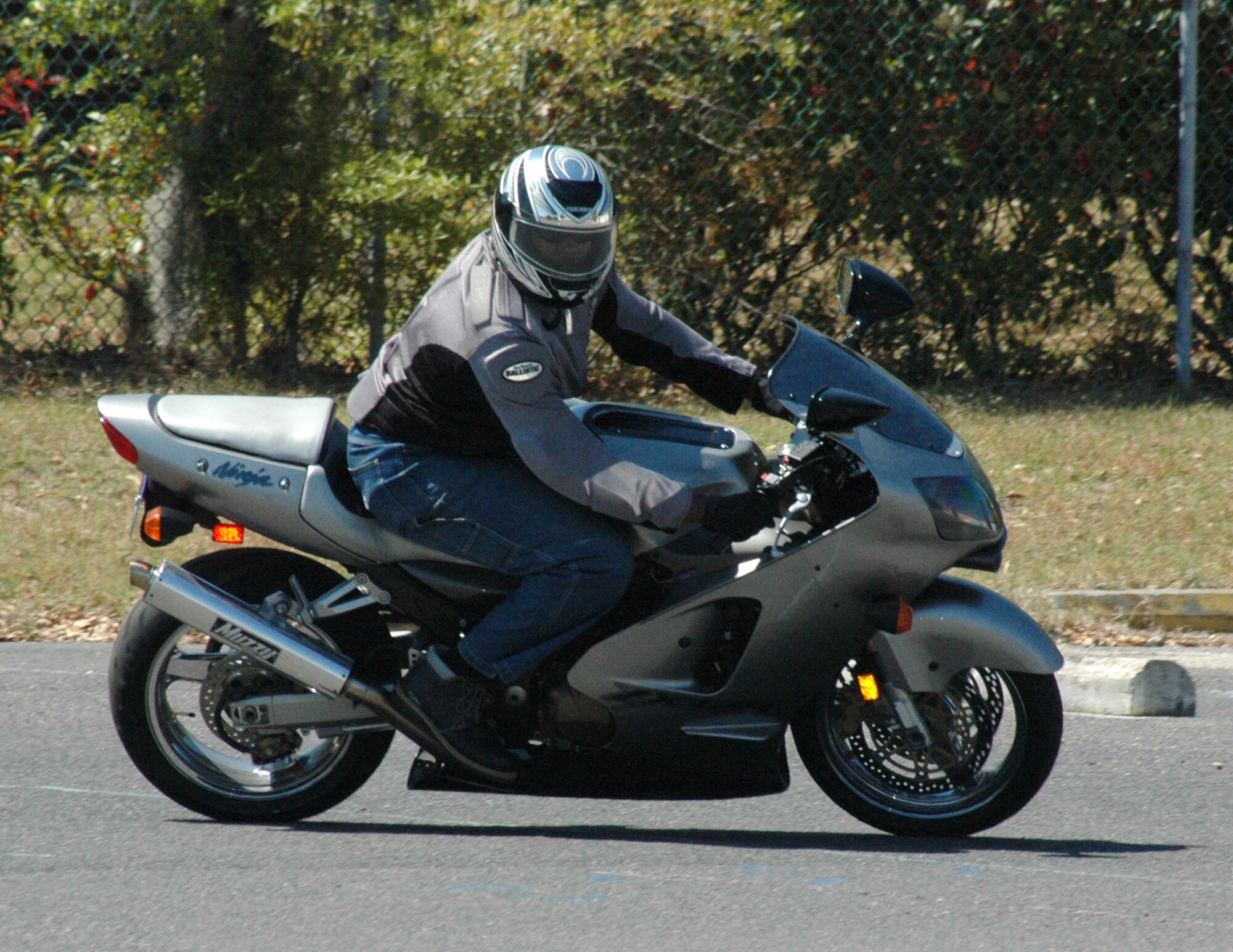 Senior Master Sgt. Tony Levine, 315th Operations Support Squadron, demonstrates a cornering technique for the students of the motorcycle safety course. Sergeant Levine was one of 11 rider coach candidates to complete the motorcycle safety instructor's course hosted by Charleston Air Force Base.  (Photo by Tech. Sgt. Mary Hinson, USAFR)