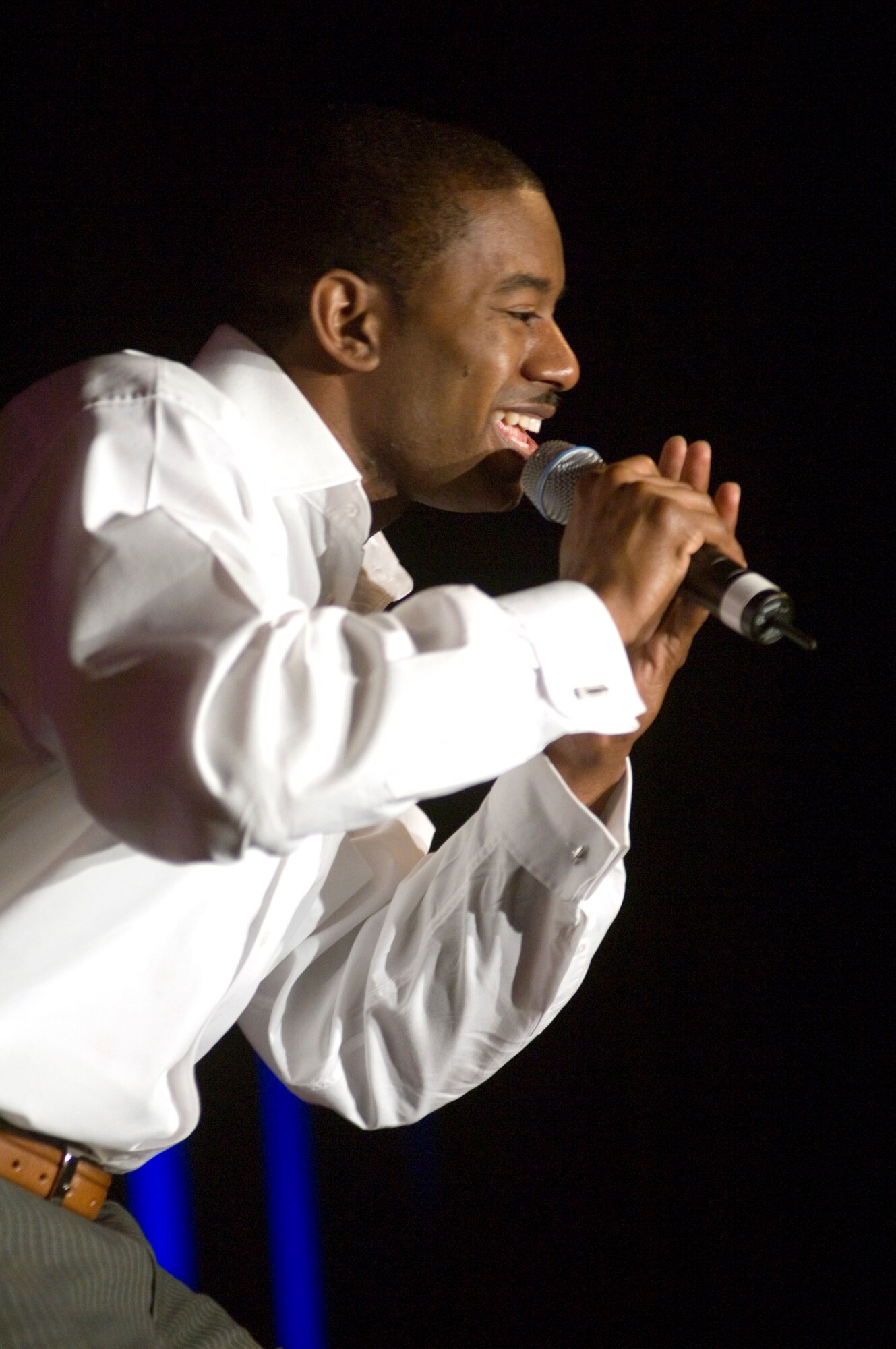 Senior Airman Antonio Howard entertains the crowd on his way to first place in the United States Air Forces in Europe's "USAFE Idol" contest on Saturday, April 22, 2006, at Ramstein Air Base, Germany. Airman Howard, from Dublin, Ga., is a security forces journeyman for the 703rd Munitions Squadron at Volkel Air Base, Netherlands. (U.S. Air Force photo/Master Sgt. John E. Lasky) 