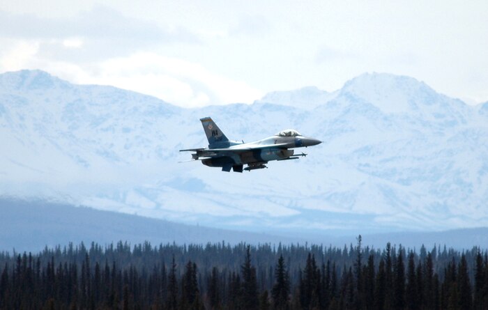 An "enemy" F-16 Fighting Falcon from the 64th Aggressor Squadron, Nellis Air Force Base, Nev., takes off from Eielson AFB, Alaska, during Red Flag-Alaska 06-2. The unit is playing the "hostile" force in the wargame scenarios. (U.S. Air Force photo/Tech. Sgt. Jeff Walston)
