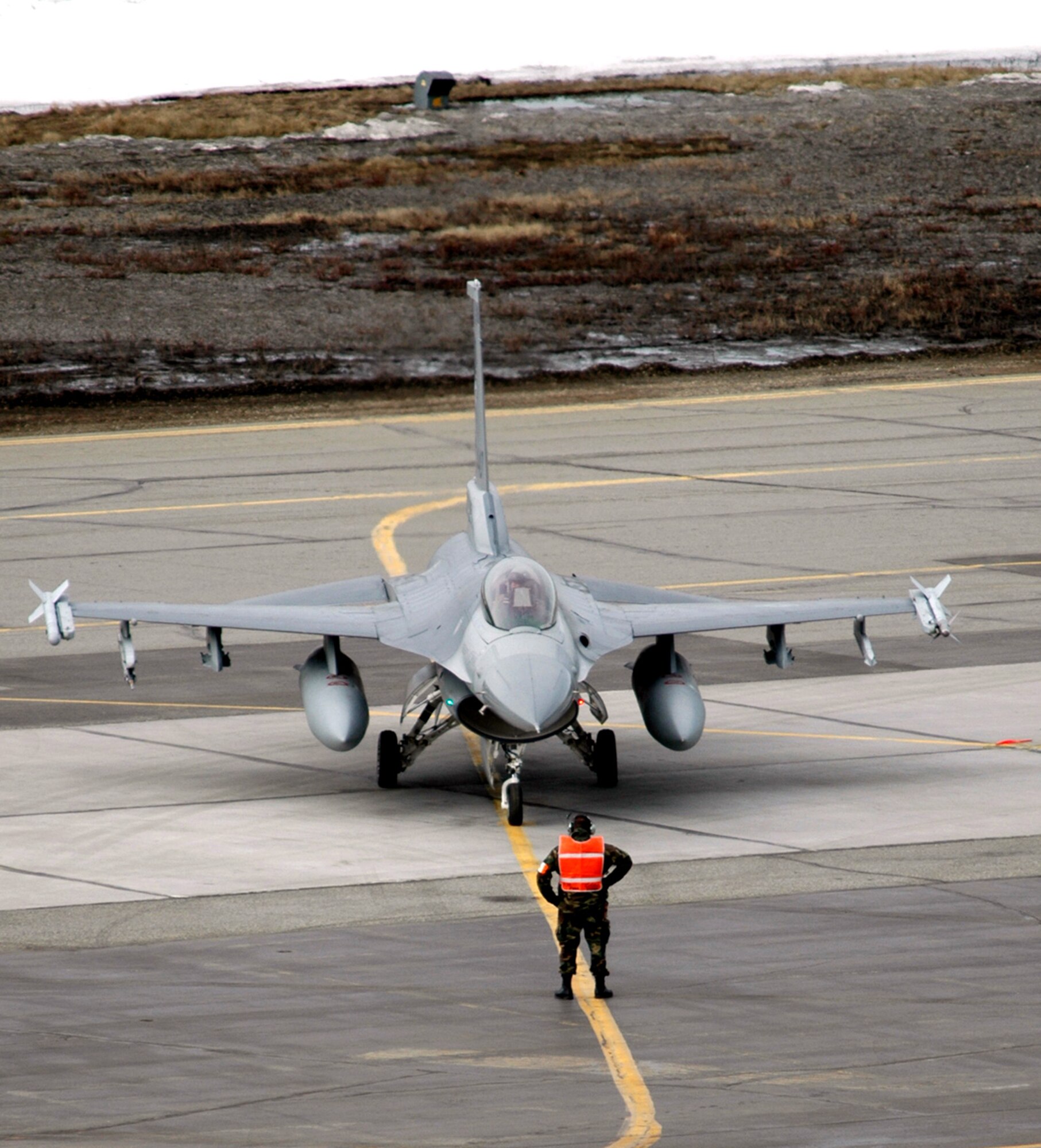 An F-16 Fighting Falcon from the Air National Guard's 175th Fighter Squadron at Sioux Falls, S.D., is prepped for a familarization flight during Red Flag-Alaska 06-2 at Eielson Air Force Base, Alaska. The 175th FS is part of the "friendly" forces during the wargame scenarios. (U.S. Air Force photo/Tech. Sgt. Jeff Walston)
