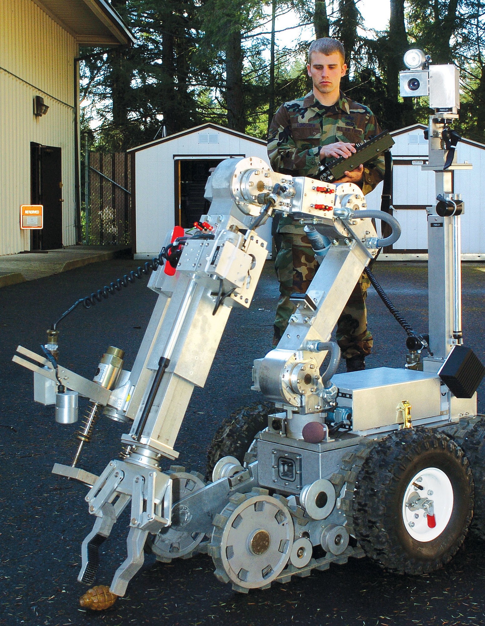 MCCHORD AIR FORCE BASE, Wash., - Airman First Class Shawn Lundgren operates the Remotec Andros robot. Airmen Lundgren is an explosive ordnance disposable specialists assigned to the 446th Civil Engineer Squadron, an Air Force Reserve unit here. (U.S. Air Force photo by Abner Guzman)