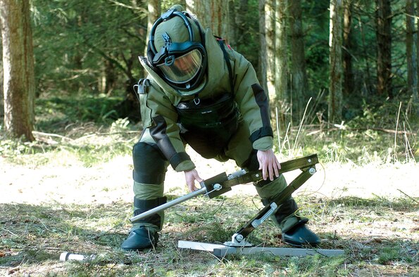 MCCHORD AIR FORCE BASE, Wash., - Airman First Class Shawn Lundgren approaches a device using a Percussion Actuated Neutralizer during an Render Safe Procedure exercise.  Airman Lundgren is an explosive ordnance disposable specialists assigned to the 446th Civil Engineer Squadron, an Air Force Reserve unit here. (U.S. Air Force photo by Abner Guzman)


