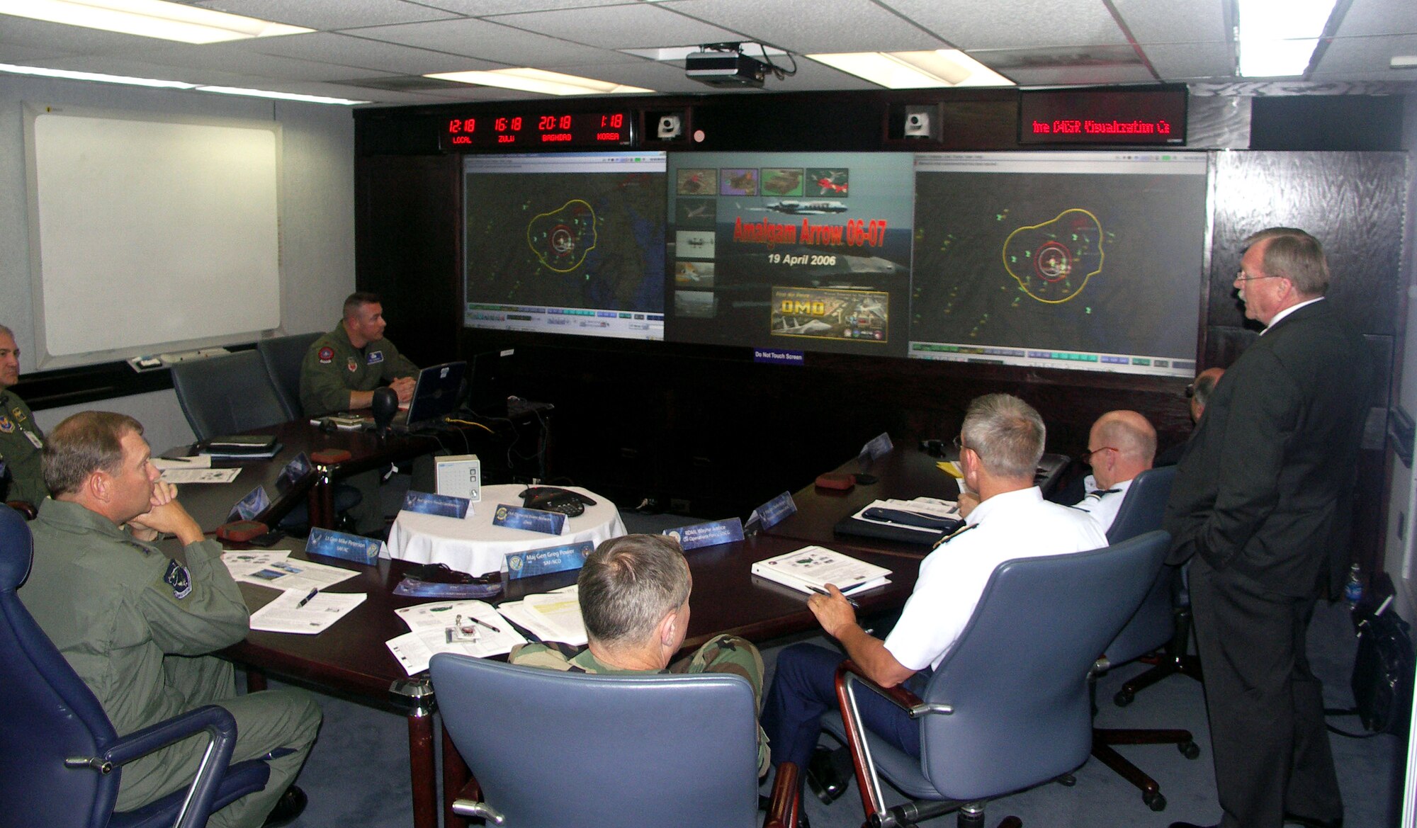 Air Force and Coast Guard leaders participate in a homeland defense exercise Wednesday, April 19, 2006, at the Pentagon's C4ISR Visualization Center. The center uses both virtual and real-world technologies to allow Department of Defense leaders to interact with experiments, exercises, wargames, training and real-world events. (U.S. Air Force photo)
