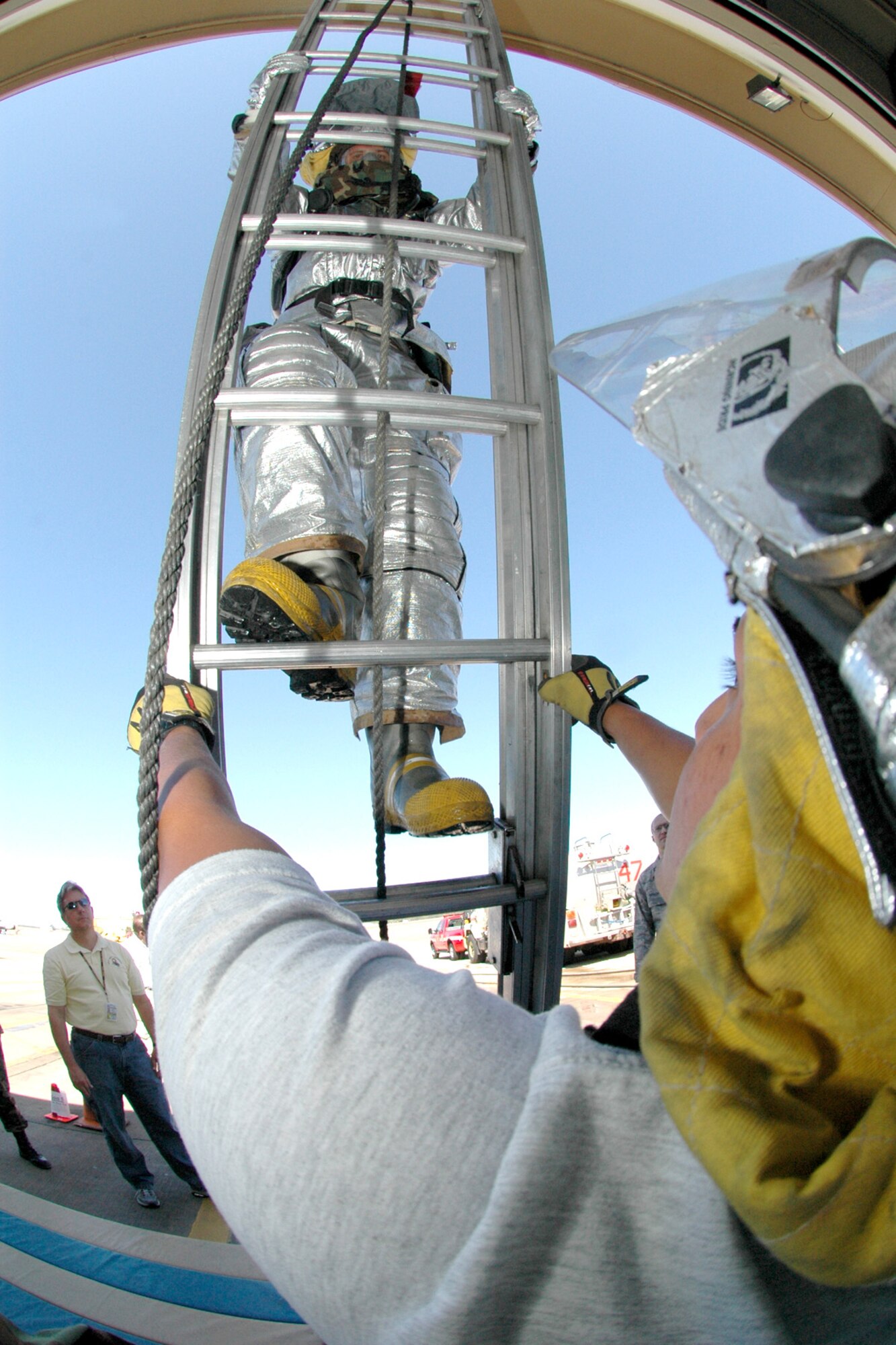 Airman 1st Class Cody Ponder climbs a ladder while testing the Air Force's new firefighter protective suits at Eglin Air Force Base, Fla. Airman Ponder is a firefighter with Eglin's 96th Civil Engineer Squadron. (U.S. Air Force photo/Senior Airman Mike Meares)
