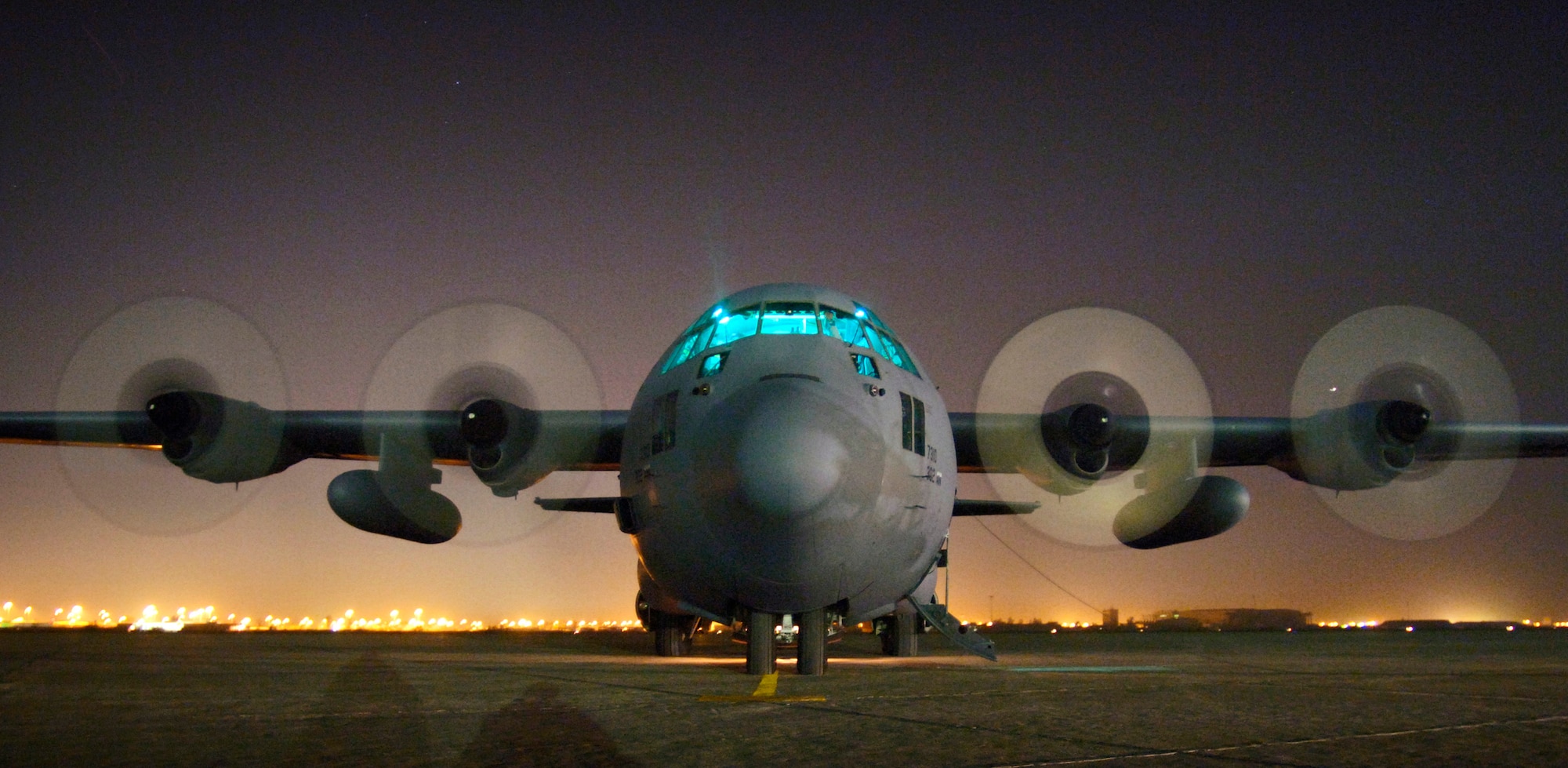 An Air Force Reserve C-130 Hercules is readied for takeoff at Sather Air Base, Iraq, on Wednesday, April 19, 2006. The aircraft is from the 302nd Airlift Wing at Peterson Air Force Base, Colo. (U.S. Air Force photo/Master Sgt. Lance Cheung) 
