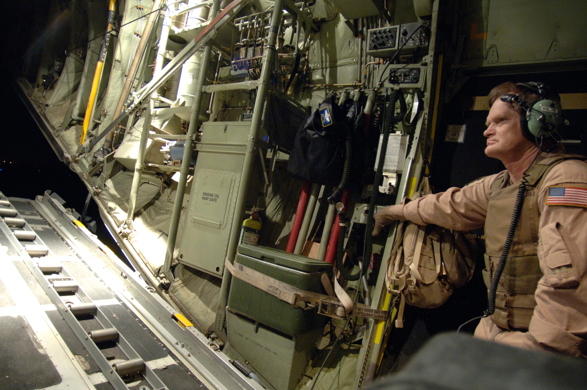 Master Sgt. Keith Knepp lowers the cargo-loading ramp of a C-130 Hercules. Sergeant Knepp recently exceeded his 10,000th hour of aircrew experience. The reservist is deployed from the 327th Airlift Squadron at Willow Grove Air Reserve Station, Pa., to the 746th Expeditionary Airlift Squadron in support of Operation Iraqi Freedom. (U.S. Air Force photo/Master Sgt. Lance Cheung)