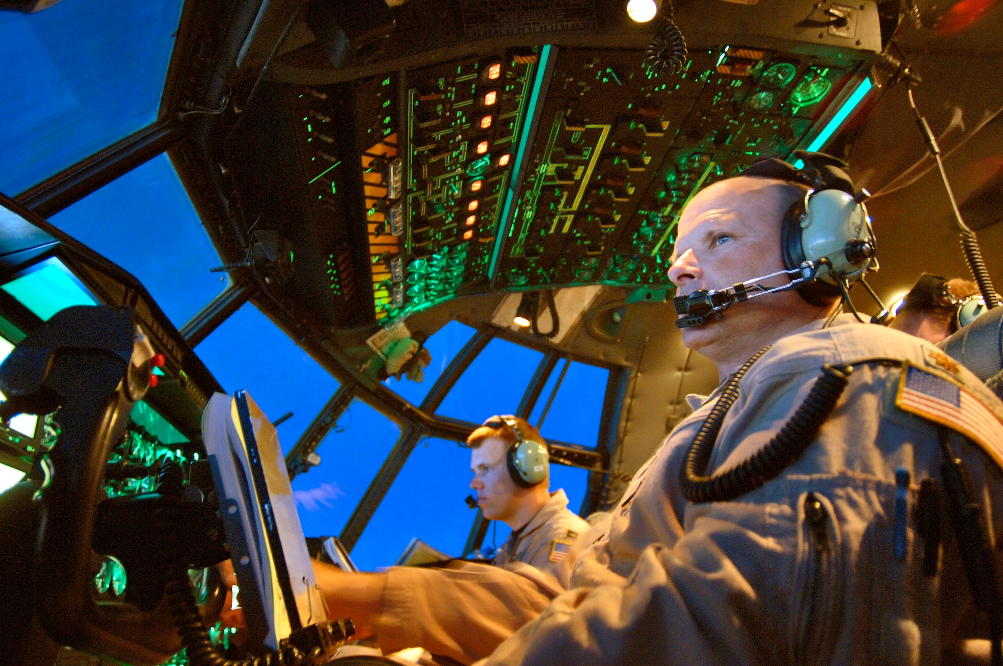 Maj. Mike Steigerwald (right) and Capt. Brady Ohr view the control panel on their C-130 Hercules and surrounding airspace during a combat support flight over Southwest Asia on Wednesday, April 19, 2006. The reservists are deployed to the 746th Expeditionary Airlift Squadron from the 327th Airlift Squadron at Willow Grove Air Reserve Station, Pa. (U.S. Air Force photo/Master Sgt. Lance Cheung)
