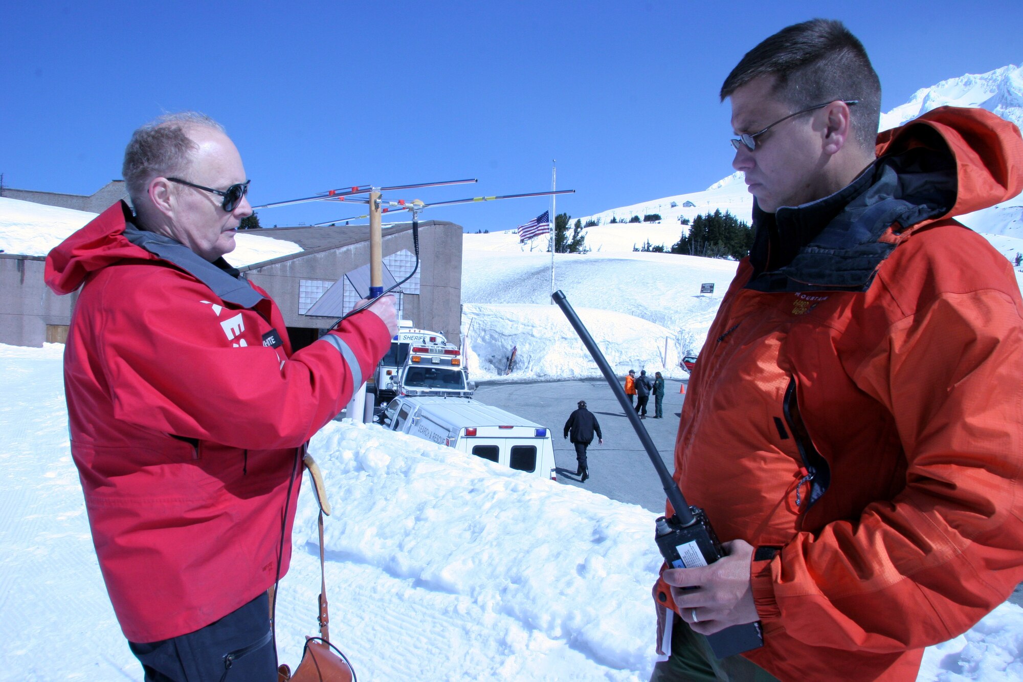 Mr. Hal Lillywhite, Portland Mountain Rescue volunteer and author of "Bring yourself back alive" (left) and Capt. Chris Bernard, 304th Rescue Squadron combat rescue office use the Yaggi directional antenna to track the transmitting beacon from a Portland Mountain Locator Unit worn by the missing climbers in a search and rescue mock exercise scenario on Mount Hood, Ore. April 22, 2006. (U.S. Air Force Photo/Ruby Zarzyczny)