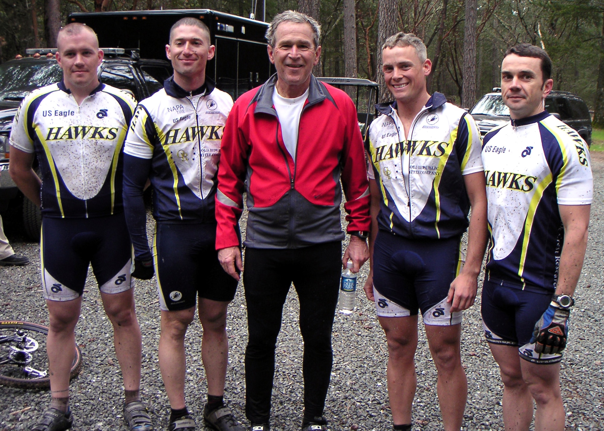 (Left to right) Staff Sgt. Brian Young, Capt. James Weinstein, President George W. Bush, 1st Lt. Barton Boma and Staff Sgt. Dustin Diede take a break after completing a bike ride through Los Posados Park in Napa County, Calif., on Saturday, April 22, 2006.  The president invited the four Airmen -- members of the Hawks Mountain Bike Club at Travis Air Force Base, Calif. -- to ride with him during his visit to Northern California.  (Courtesy photo/1st Lt. Barton Boma)   
