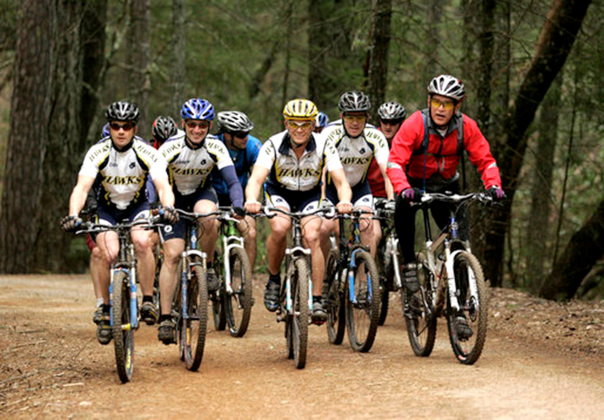 (Left to right) Staff Sgt. Dustin Diede, Capt. James Weinstein, 1st Lt. Barton Boma and Staff Sgt. Brian Young, ride alongside President George W. Bush on a trail in Napa Valley on Saturday, April 22, 2006. The president invited the four Airmen -- members of the Hawks Mountain Bike Club at Travis Air Force Base, Calif. -- to ride with him during his visit to Northern California. (White House photo/Eric Draper)
