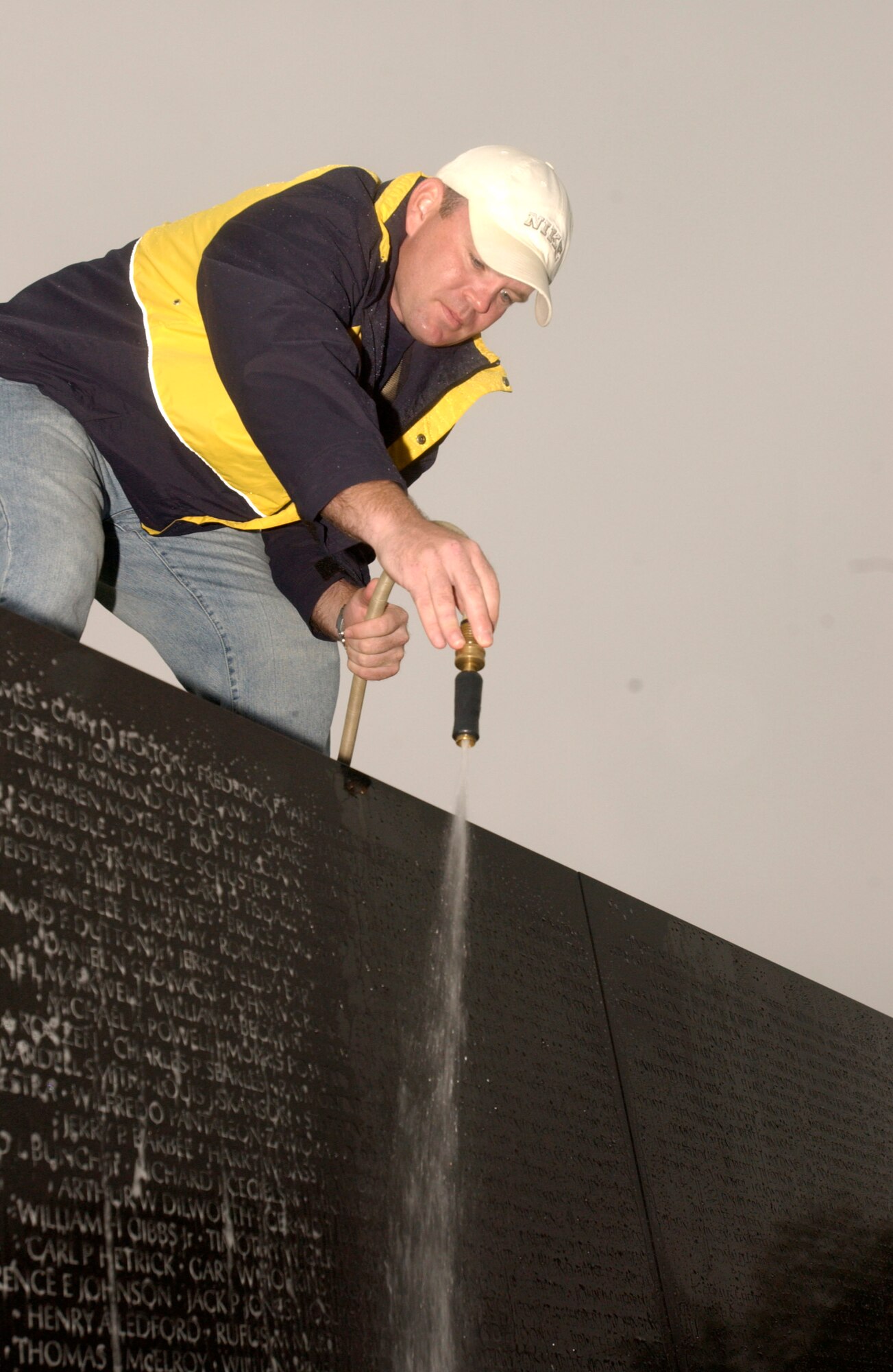 Master Sgt. Dave Stinard rinses the Vietnam Veterans Memorial on Saturday, April 22, 2006. More than 140 members of the Air Force Sergeants Association met in the nation's capital to clean the memorial early in the morning before tourists arrived. Sergeant Stinard is the AFSA chapter president at Charleston Air Force Base, S.C. (U.S. Air Force photo/Senior Airman J.G. Buzanowski)